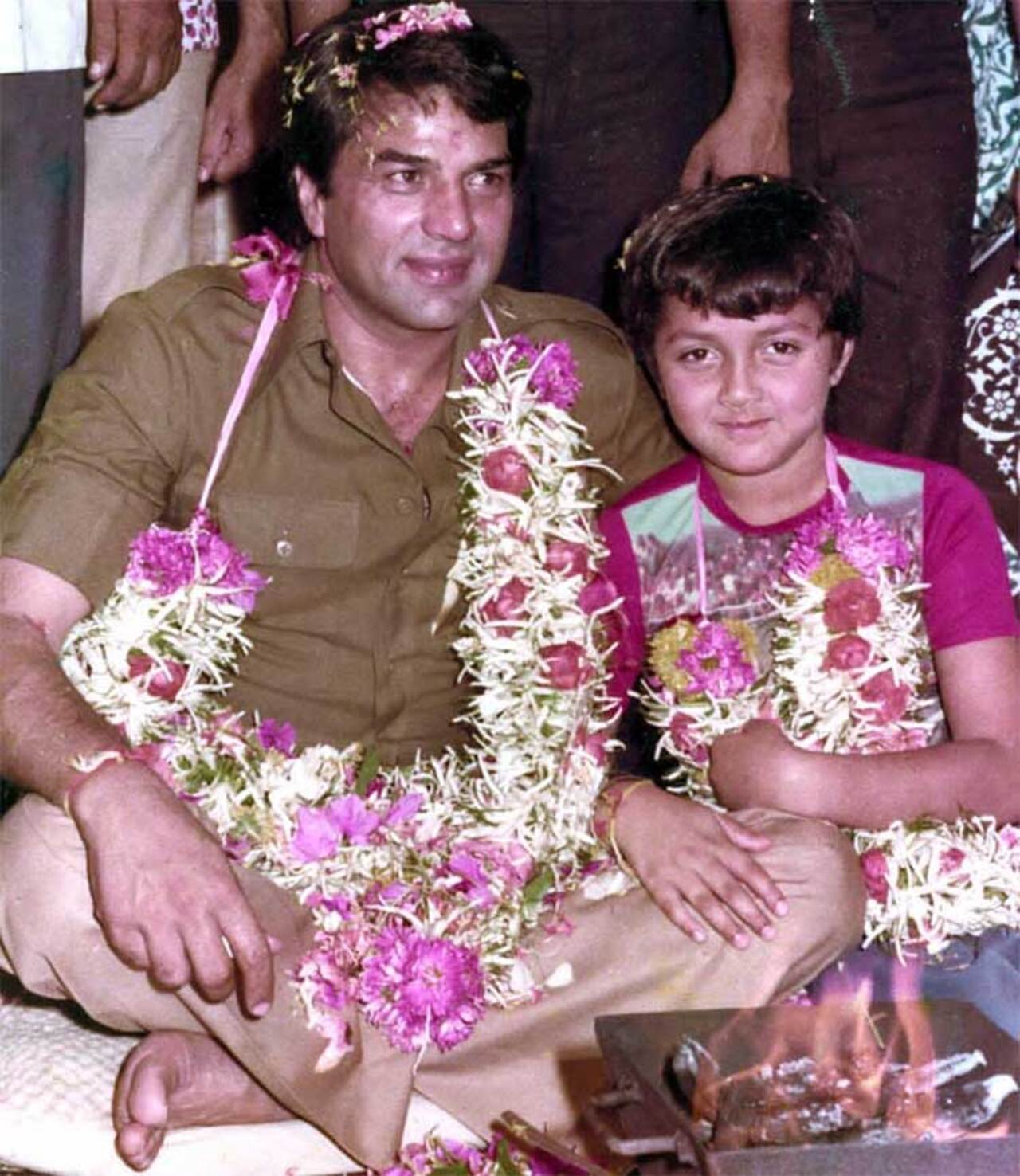 Bobby Deol posted a charming throwback photo with his father, Dharmendra, on Instagram to celebrate the latter's birthday. In the picture, a young Bobby is seen giving a bashful smile to the camera.