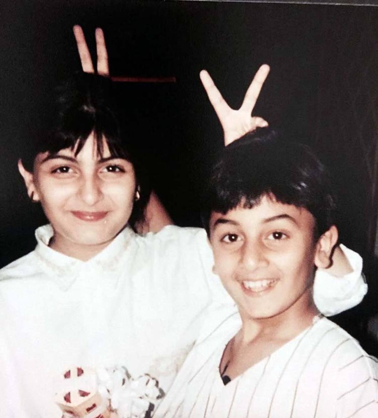 Seems like Ranbir Kapoor had a penchant for making V symbols since always! Here, his victim is his sister Riddhima Kapoor, who teased back with equal vigour. Don't know what we're talking about? See this cute throwback photo which has Ranbir posing mischievously in another Kapoor reunion. 