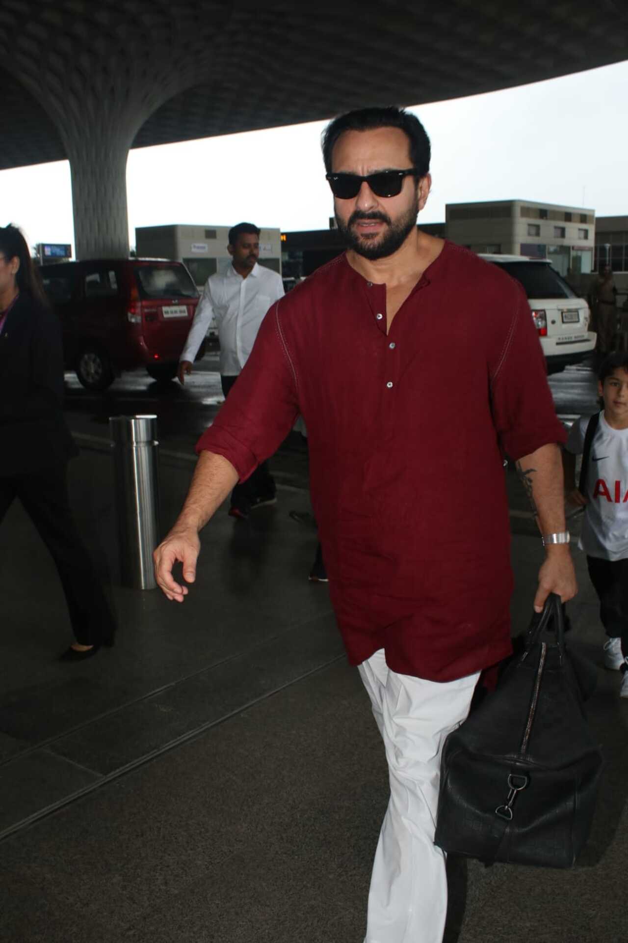 Saif Ali Khan opted for a red kurta with white pyjama for his airport look