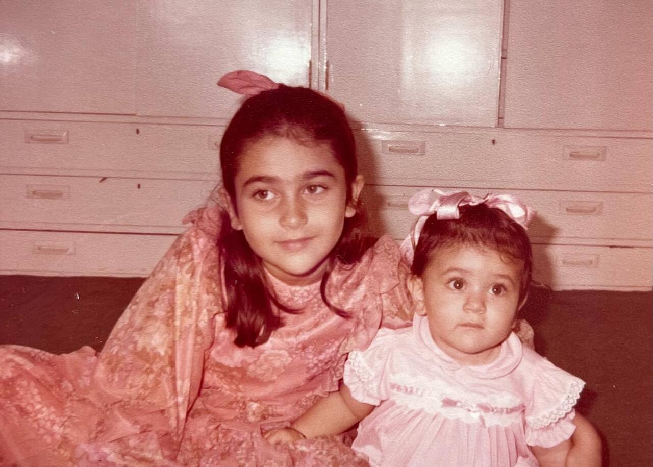 Karisma Kapoor seems to be on babysitting duty for adorable munchkin Kareena Kapoor. How can you say no to that face? Elder sibling problems only.