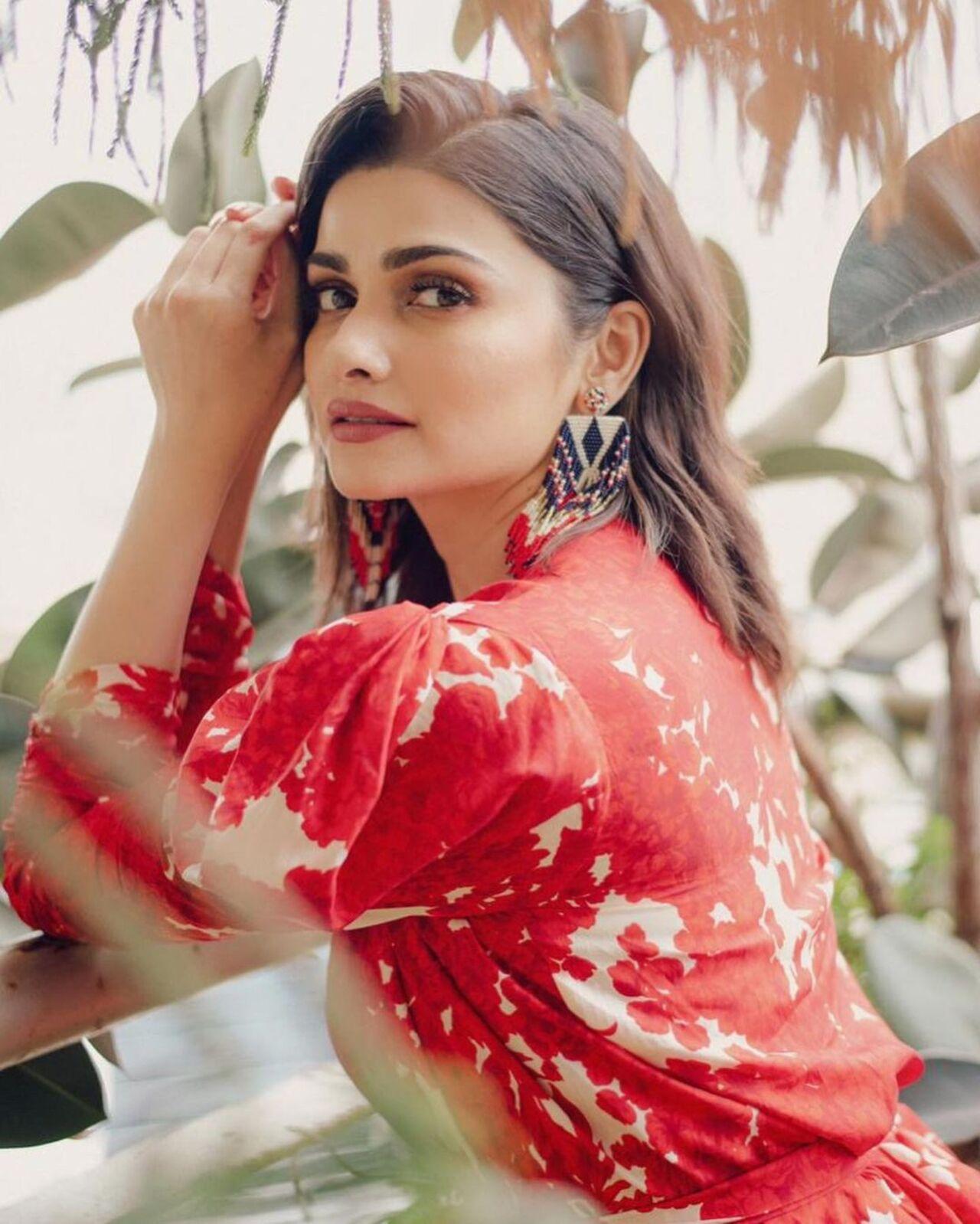 Prachi Desai exuded elegance in her stunning red dress that perfectly complemented her style. She paired it with striking black earrings. Her choice of keeping her hair flowing freely added a touch of effortless allure