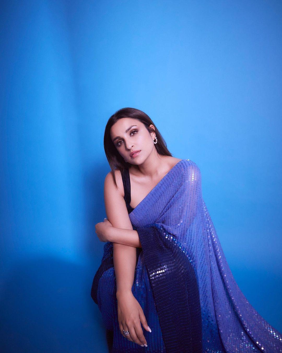 Parineeti Chopra donned a breathtaking indigo-coloured sequin saree, showcasing a look that could be the epitome of elegance for attending your best friend's wedding