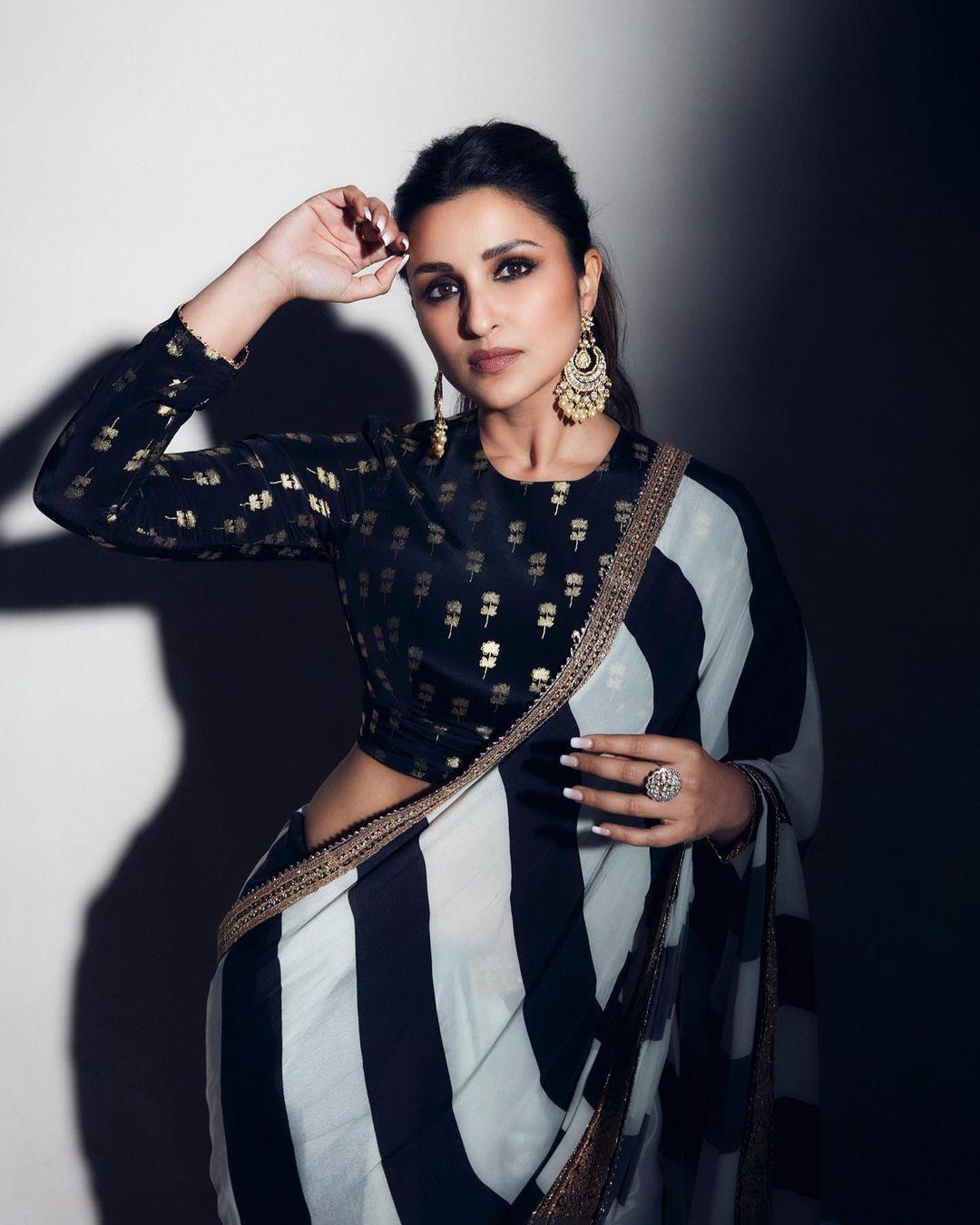 Parineeti tied her hair back in a ponytail, opting for minimal makeup. However, the dark and smoky touch to her eyes added a hint of confidence to her overall look