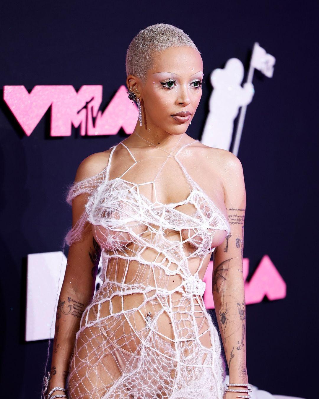 Doja Cat painted the town, but not in red, she opted for a sheer white dress that accentuated her stature