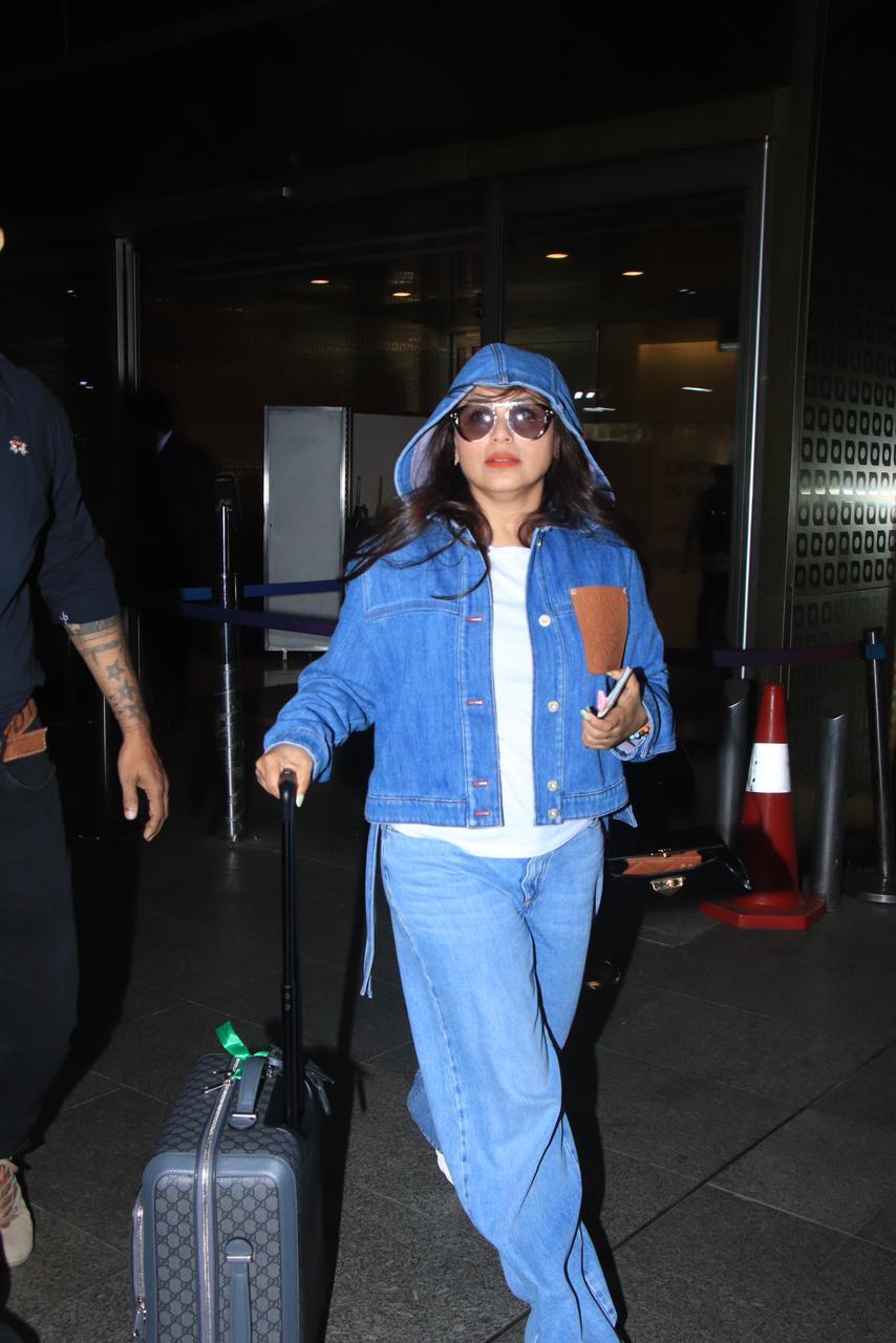 Rani Mukerji was clicket at the airport wearing a cool blue shirt paired with matching jeans