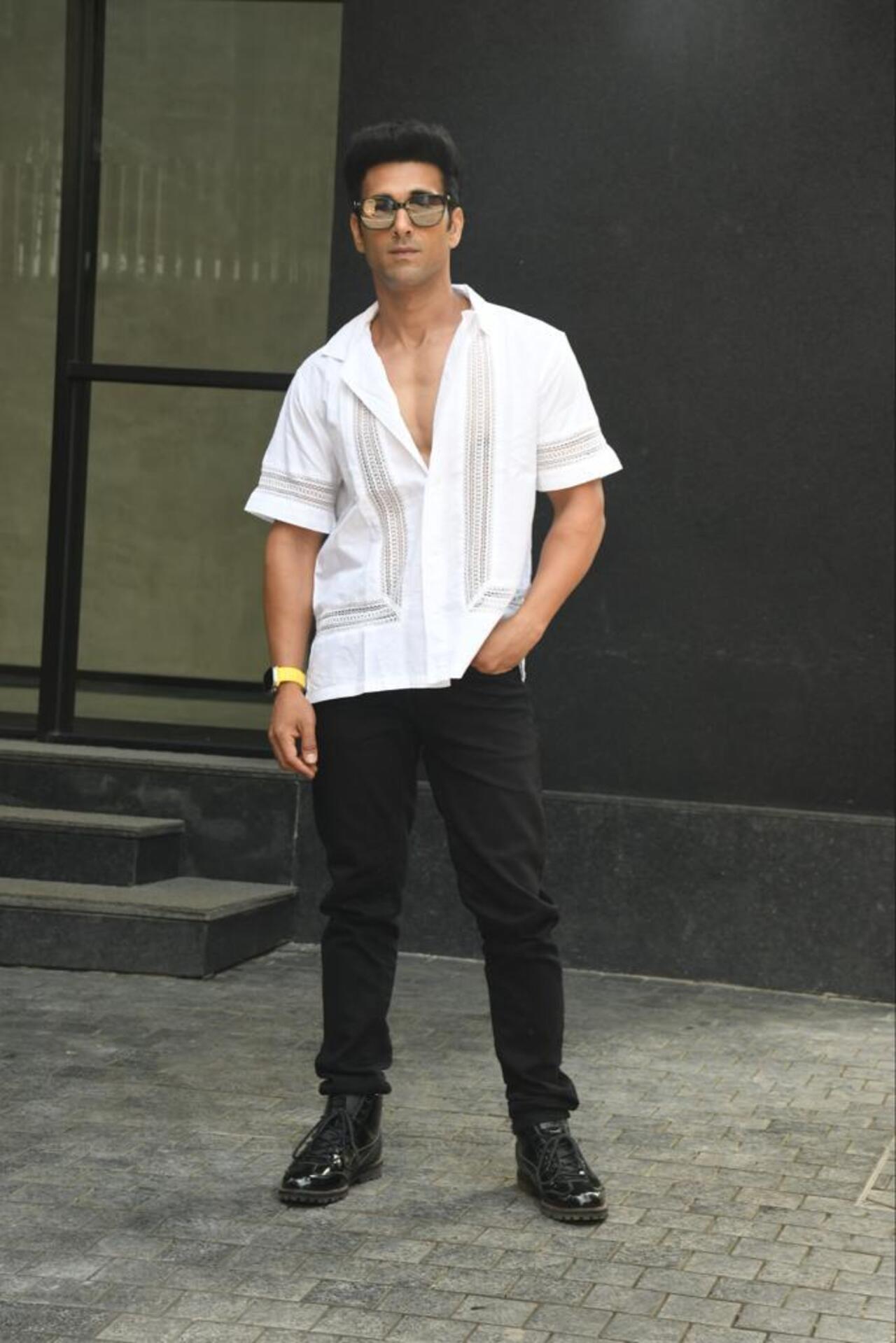 Pulkit looked handsome in a white printed shirt paired with black jeans
