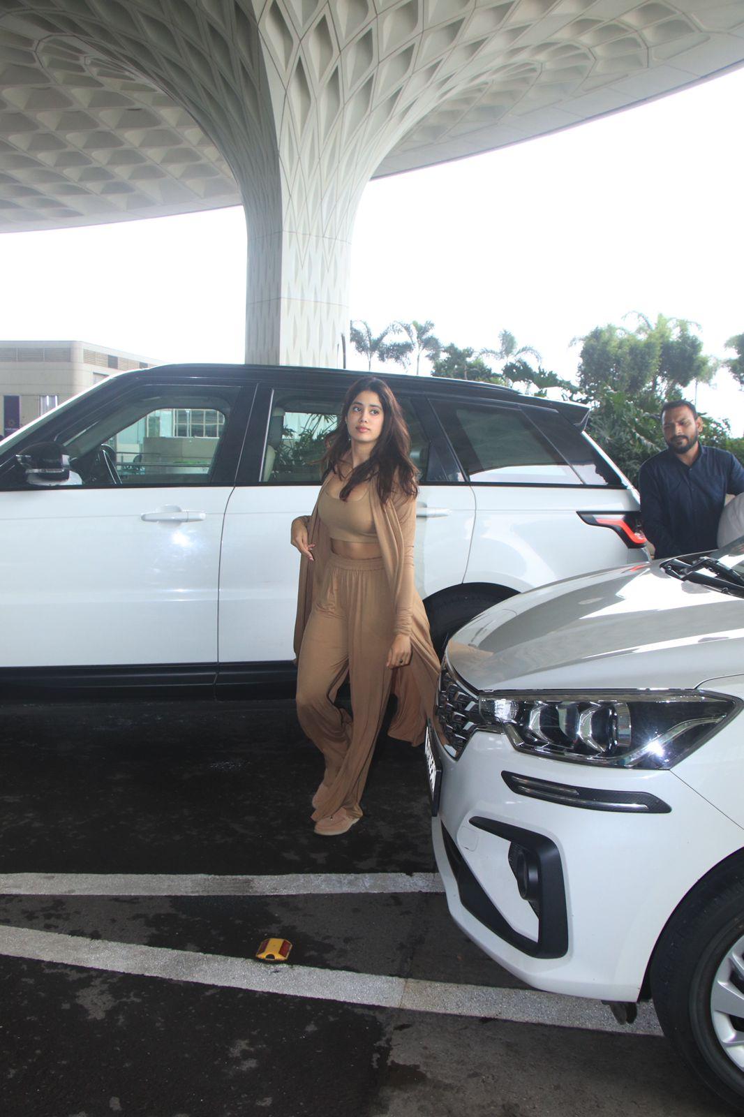 Janhvi Kapoor aced the airport look as the actress wore a brown-colored crop top with matching loose pants, complemented by a shrug