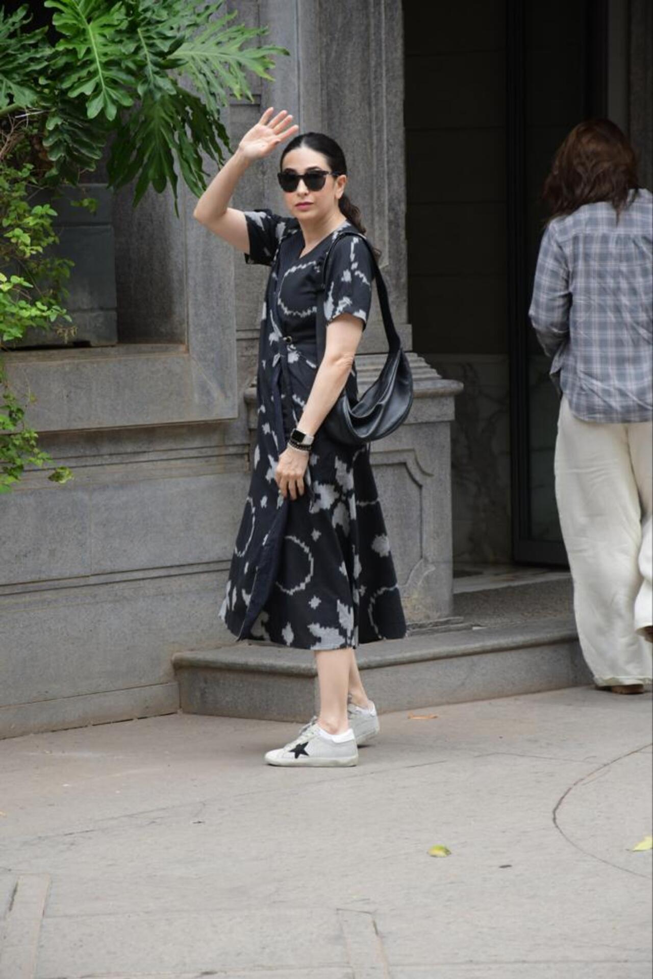 Karisma Kapoor wore a printed black dress as she went out with her sister