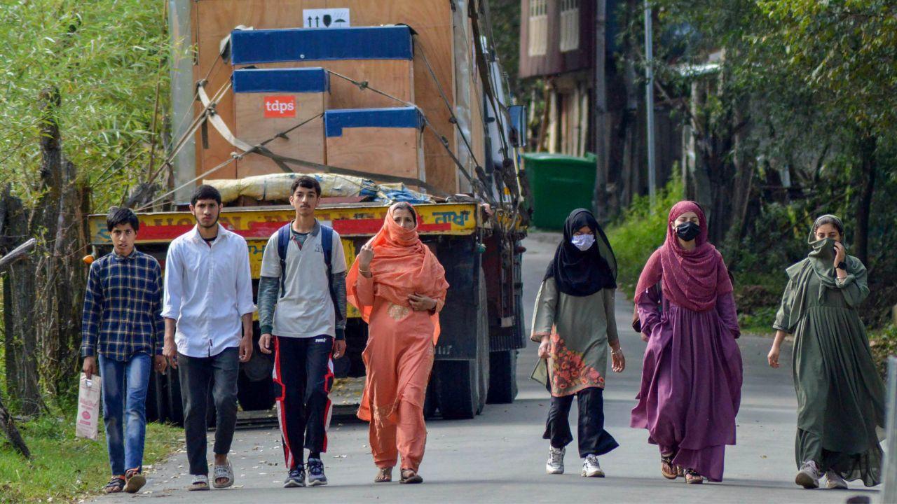 Visuals of the civilians walking past the site of an encounter with terrorists at Kokernag area, in Anantnag district surfaced on Saturday. 