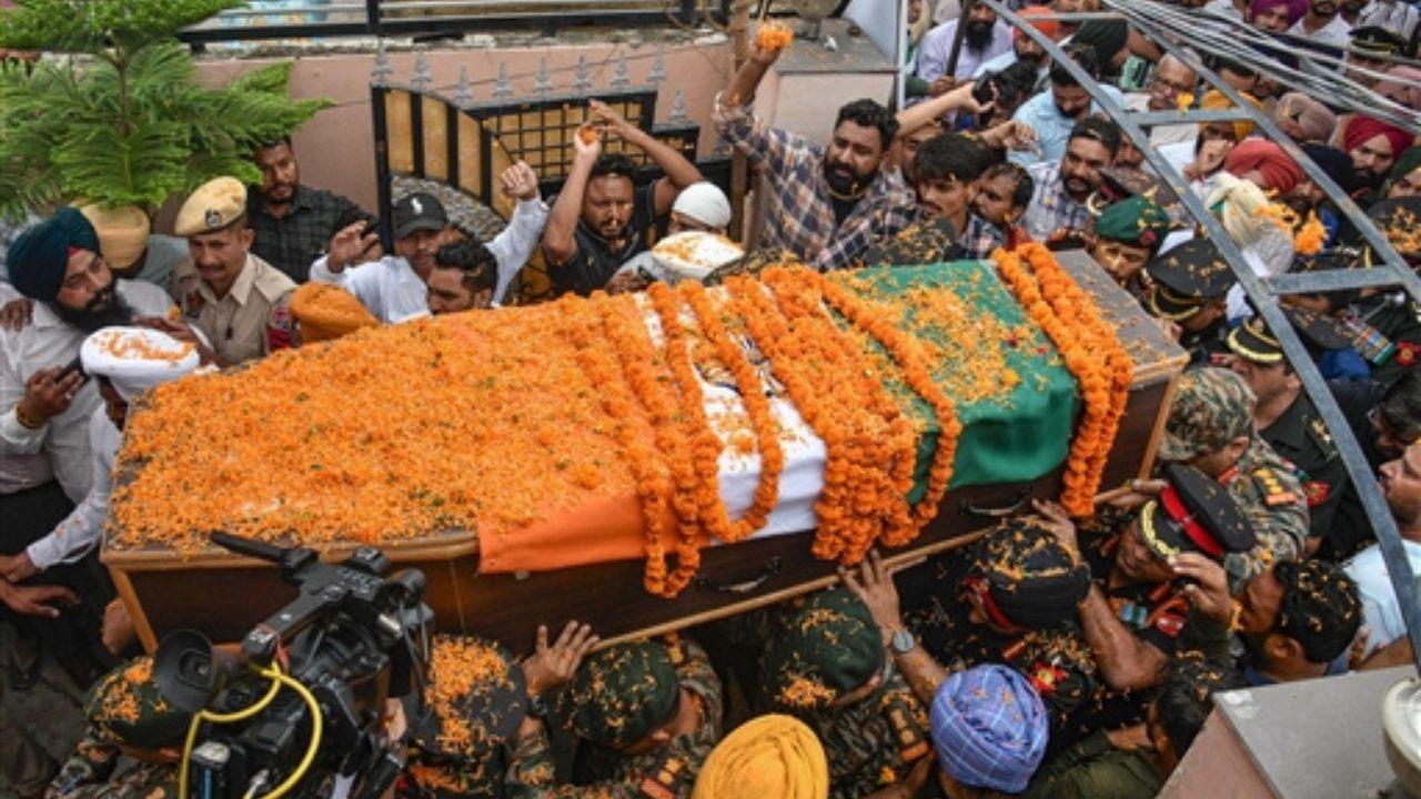 Visuals widely circulated on social media showed locals having gathered in numbers outside his residence to pay their last respects to the martyred soldier. 