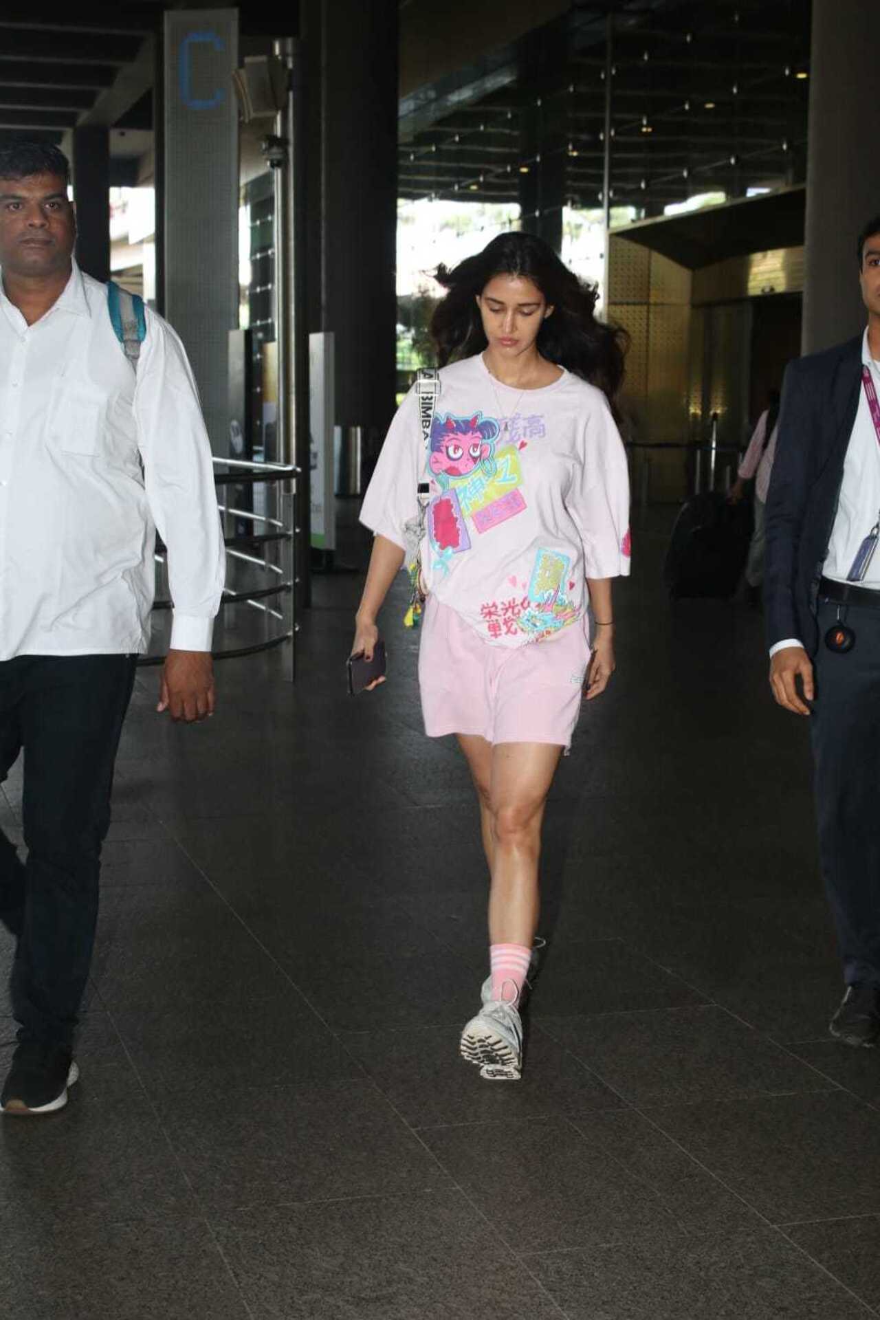 Disha Patani was spotted at the airport. The actress looked stunning in her printed pink dress paired with stylish sneakers