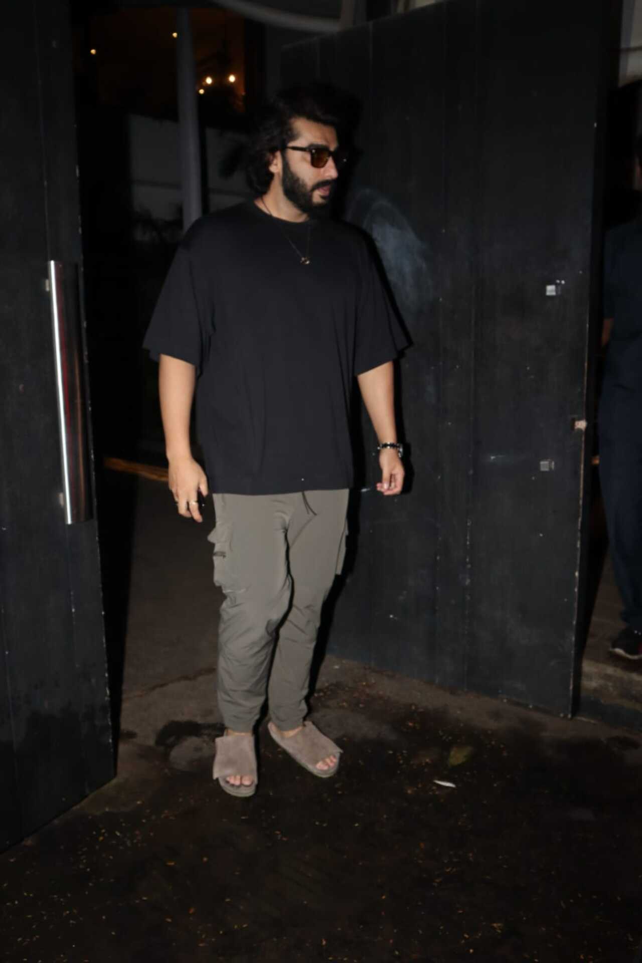 Arjun Kapoor was clicked wearing a stylish black T-shirt and cool bottoms