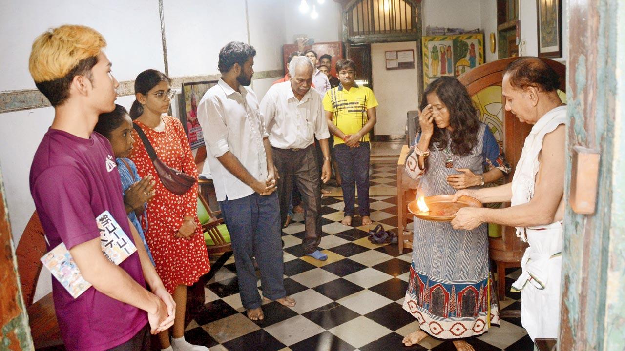 Guests and staff members gather for a morning aarti every Friday