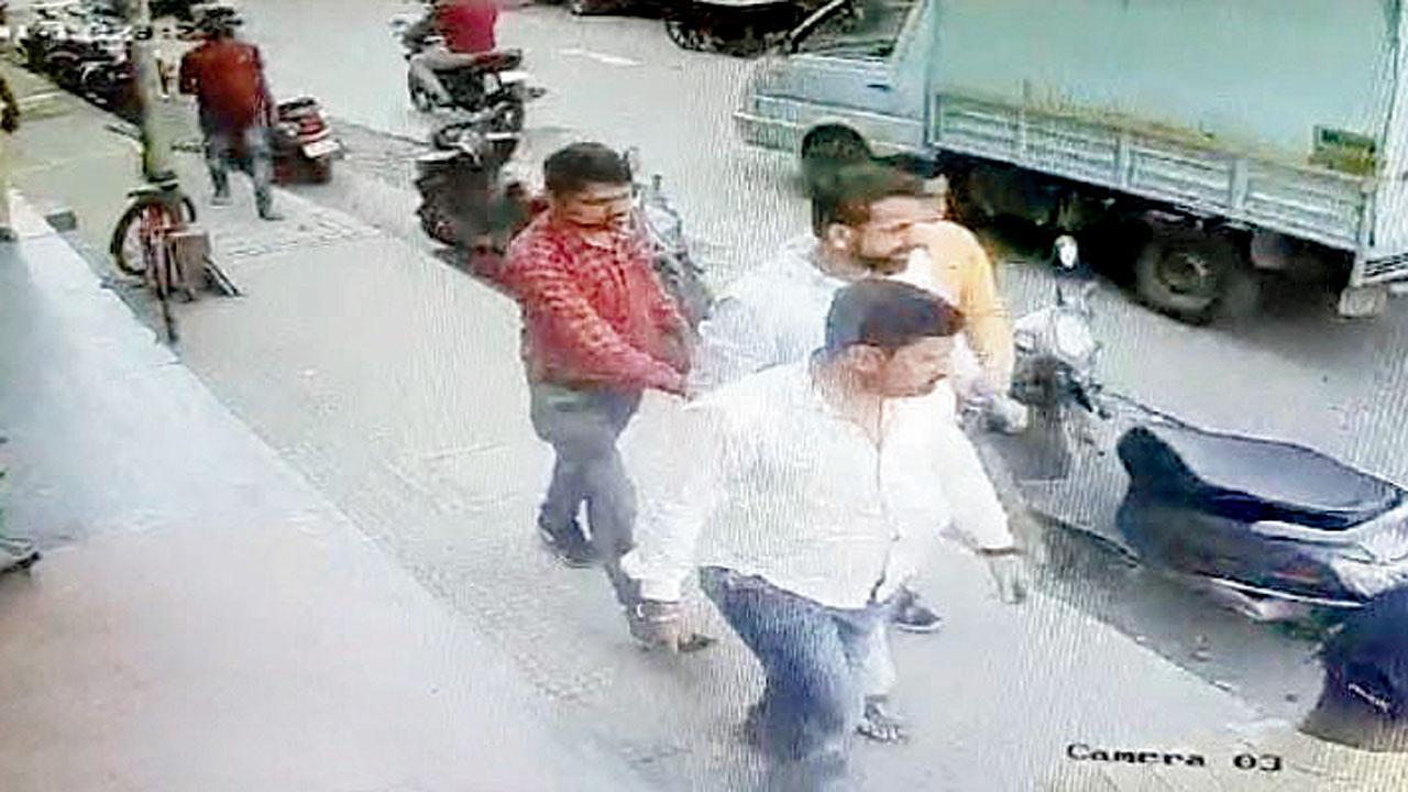 Screengrab of CCTV footage in which Duseja (in white shirt) is being taken away by cops