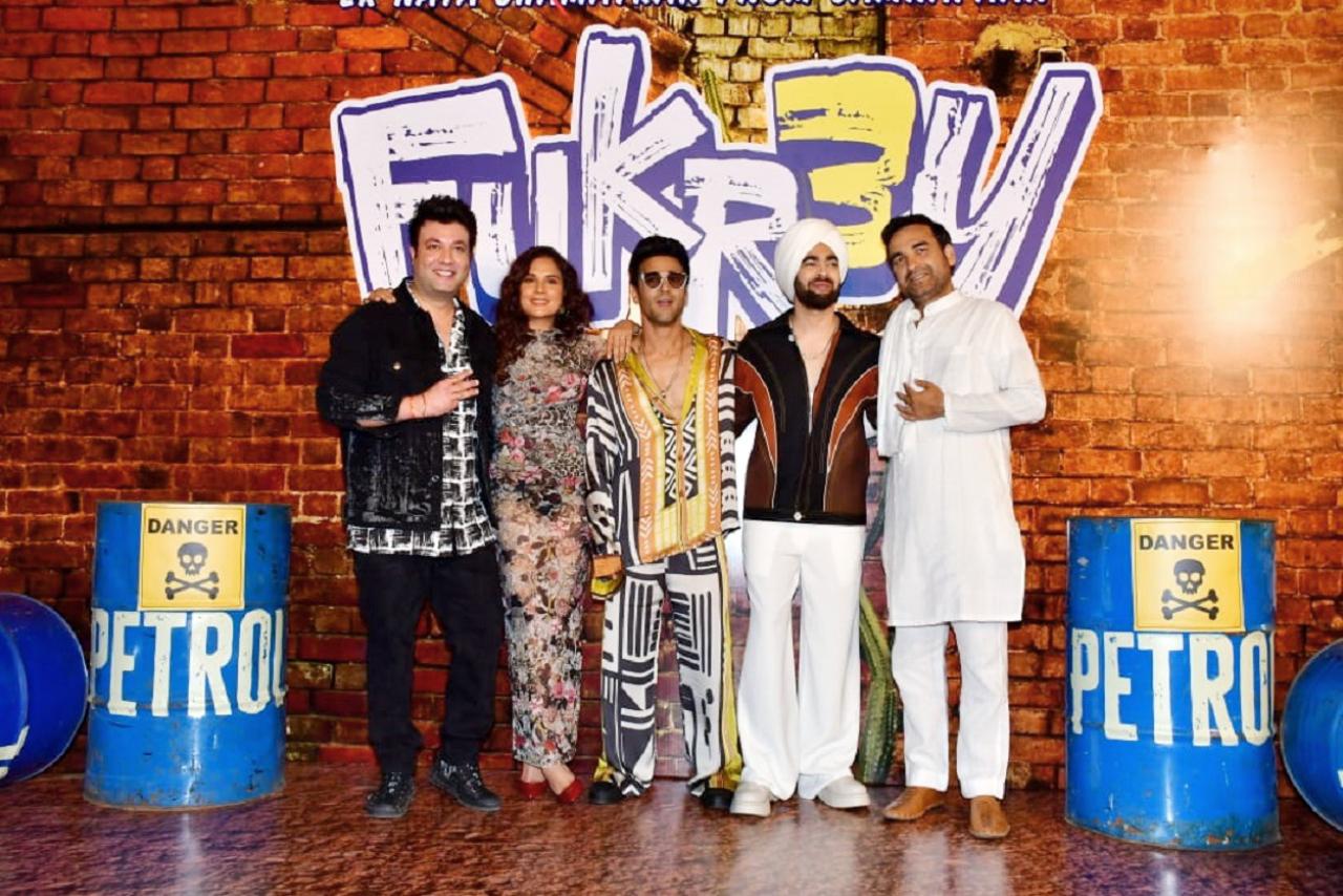 The cast of Fukrey 3 posed for the paparazzi as they attended the trailer launch event of the film