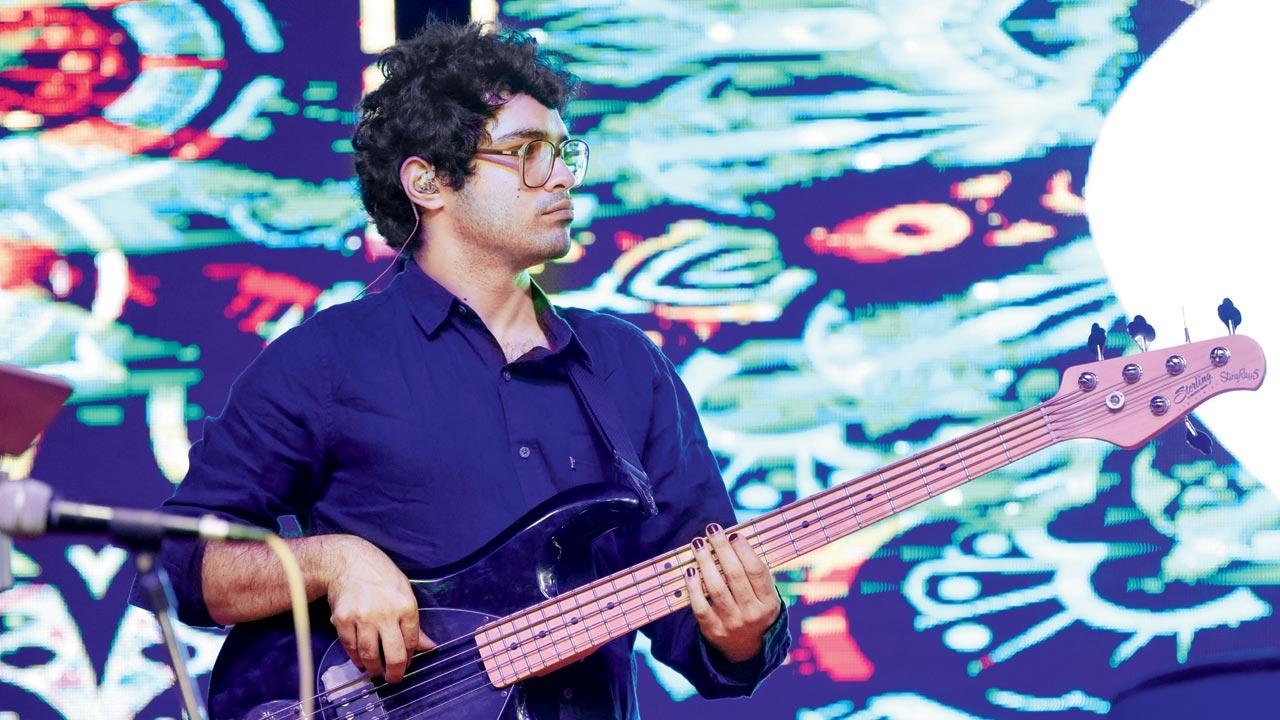 Menezes performs on the guitar