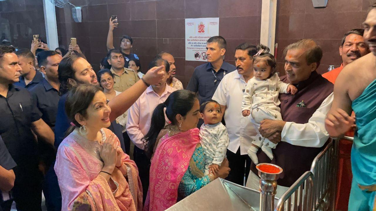 Isha Ambani's twins were also spotted at the temple. Photos of Isha carrying her daughter and her Mukesh Ambani carrying his grandson surfaced. 
