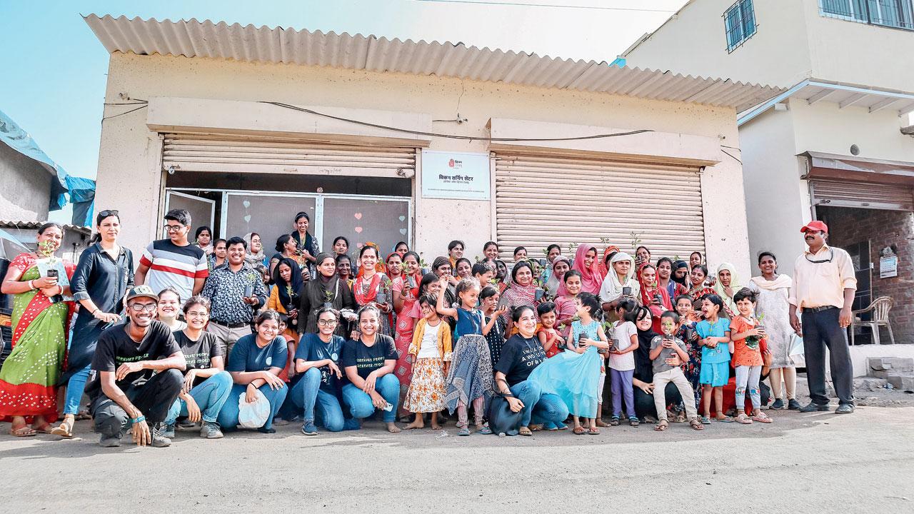 Staff and volunteers of GreenLine Mumbai during a community awareness event on waste management in, Maharashtra Nagar, Mankhurd