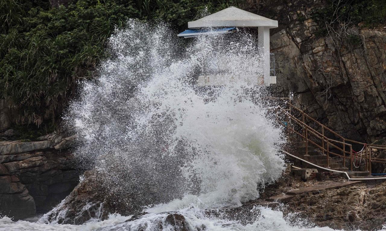 The Hong Kong Observatory raised a No. 8 typhoon signal, the third-highest warning under the city's weather system, early Friday. Its forecast said Saola with maximum sustained winds of 210 kilometers (130 miles) per hour would be 