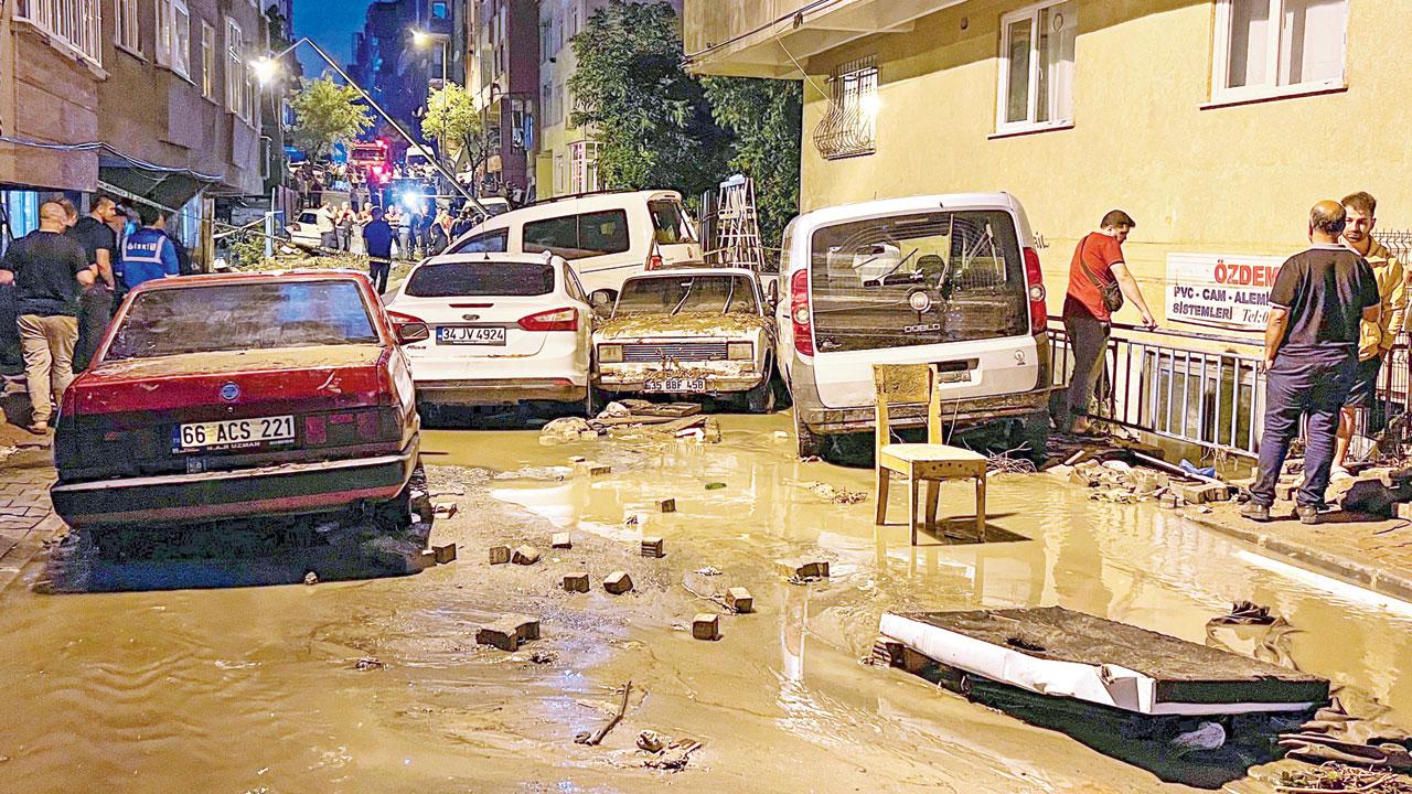 Vehicles scattered during floods after heavy rains in Istanbul. Pic/AP