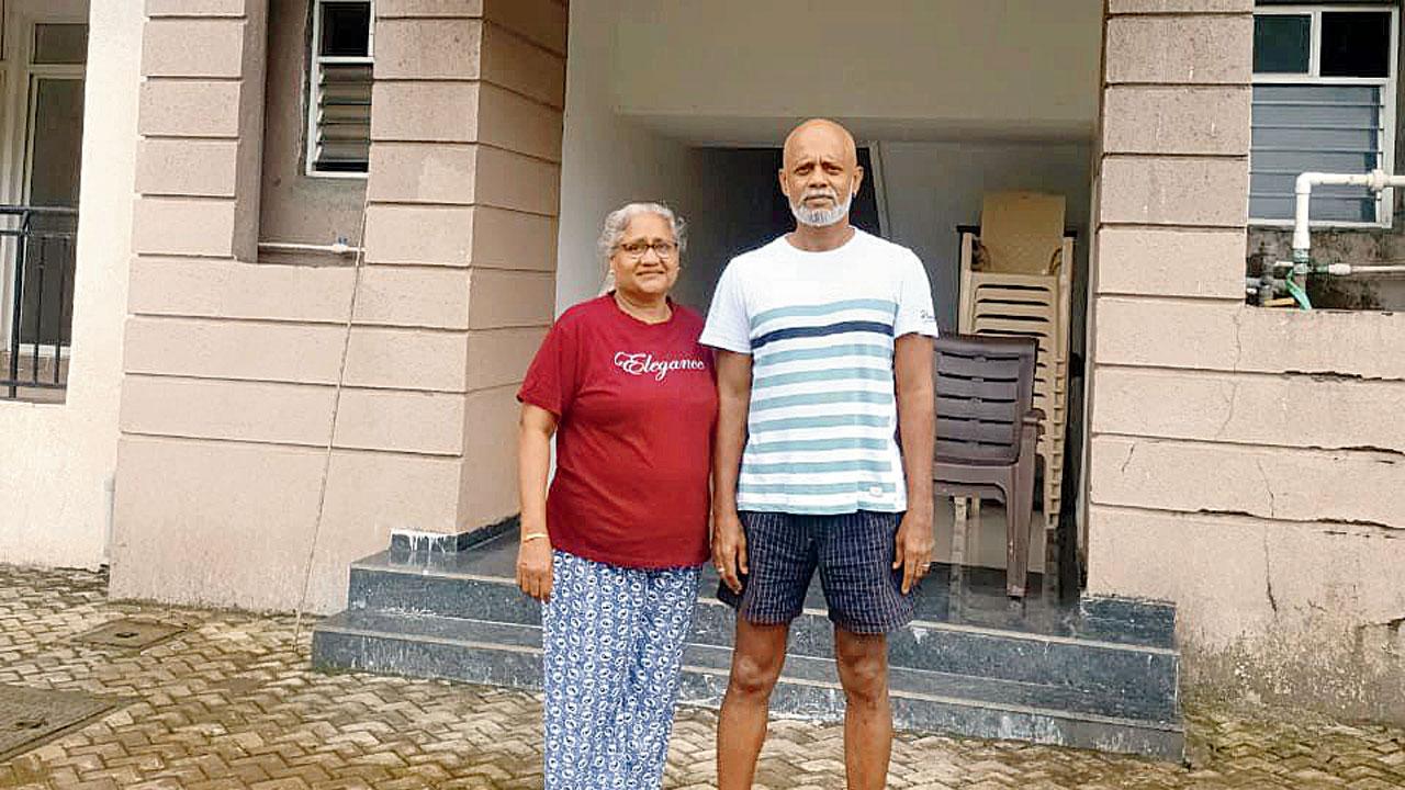 John Dantis with his wife, Merlyn outside their building in Xrbia Warai