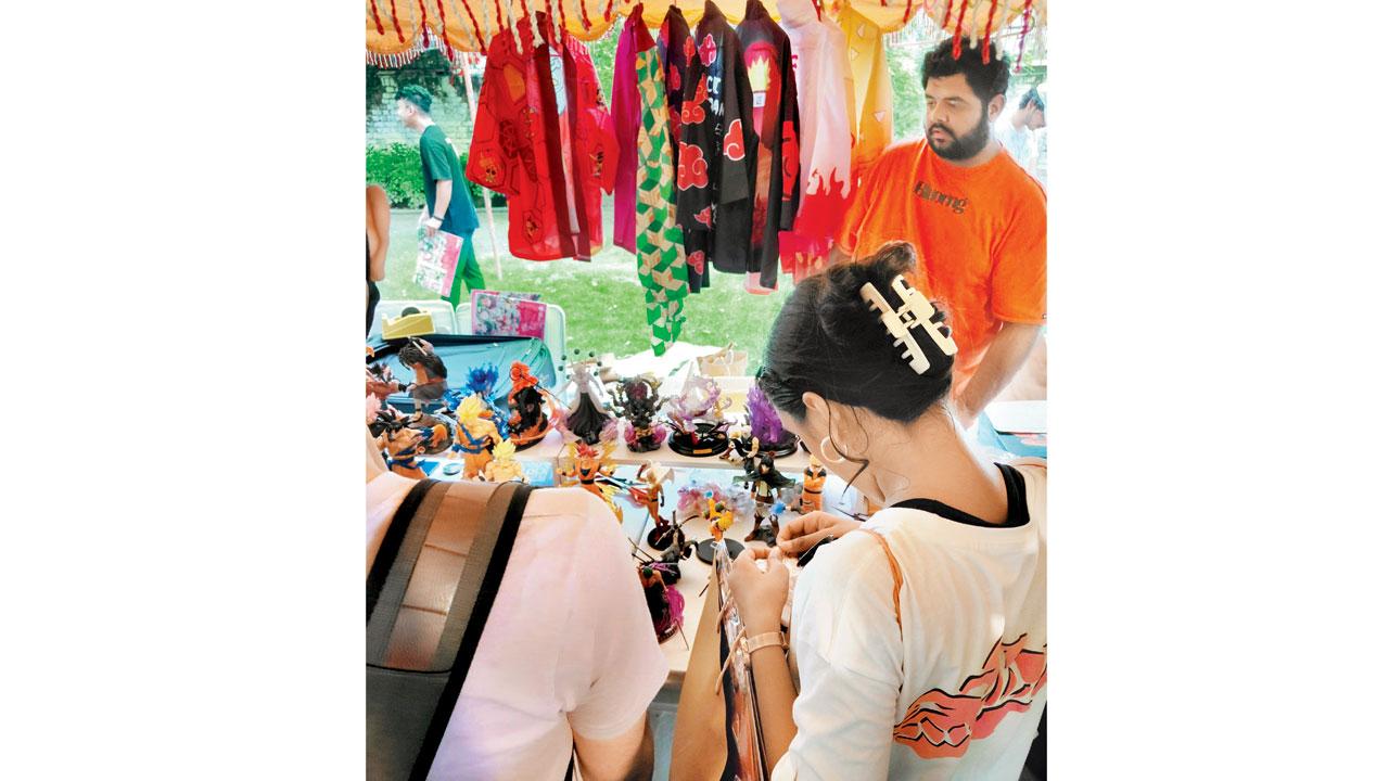 Fans browse through merchandise that includes printed shirts, jerseys and collectibles
