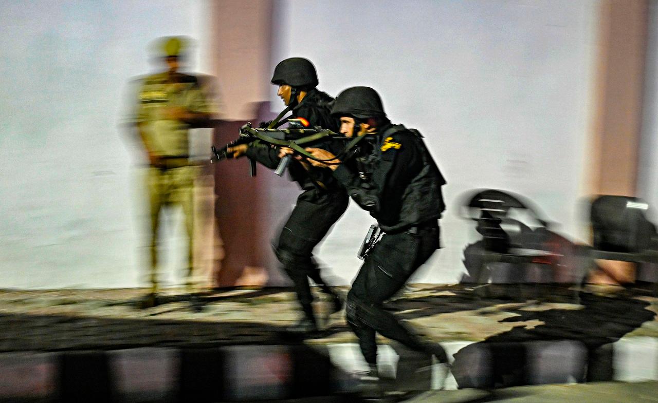 National Security Guard (NSG) commandos carry out a mock drill outside Lok Bhavan, in Lucknow