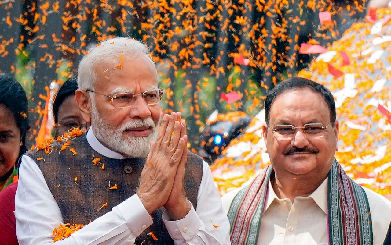 PM Modi bowed to a group of beneficiaries, who garlanded and blessed him