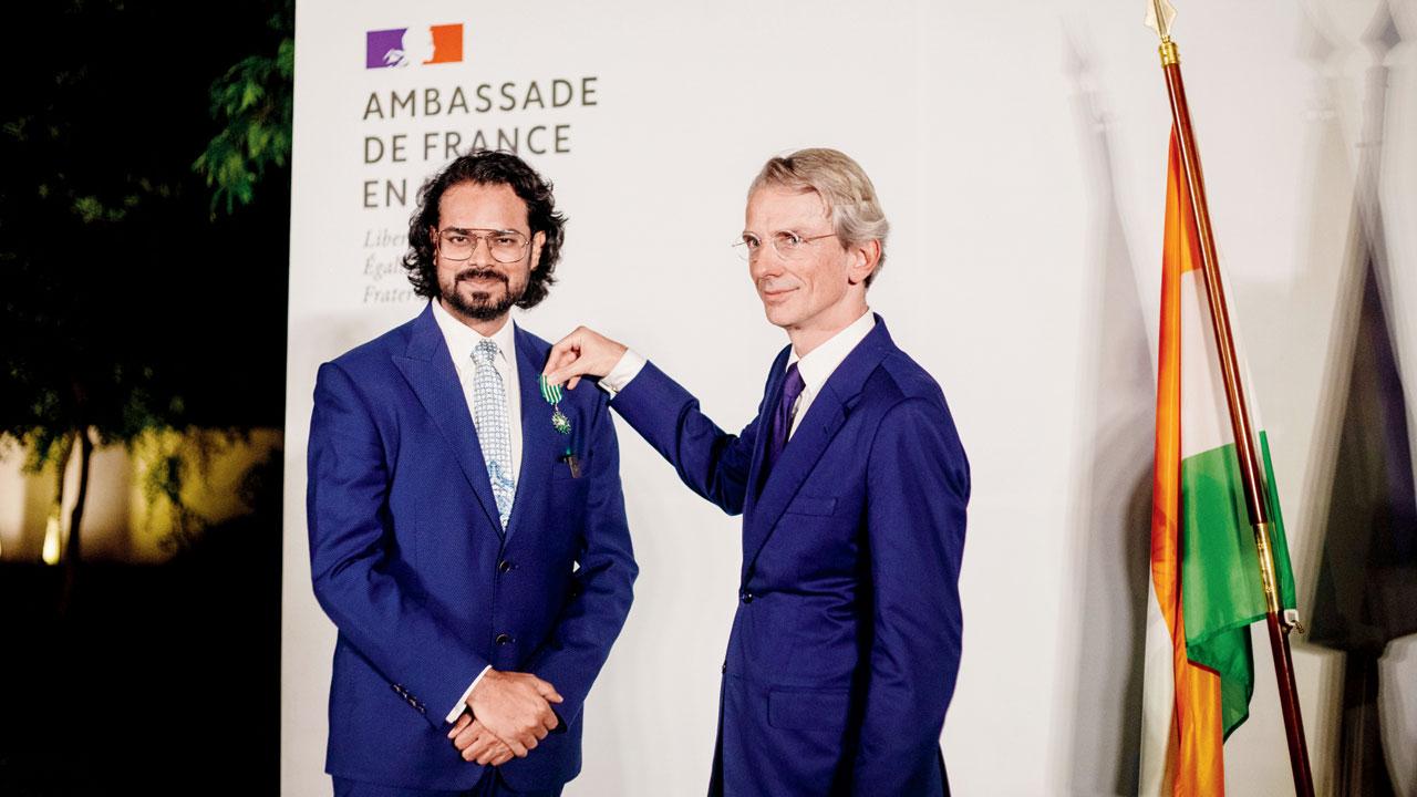 Mishra receives the award from His Excellency, Emmanuel Lenain, Ambassador of France to India
