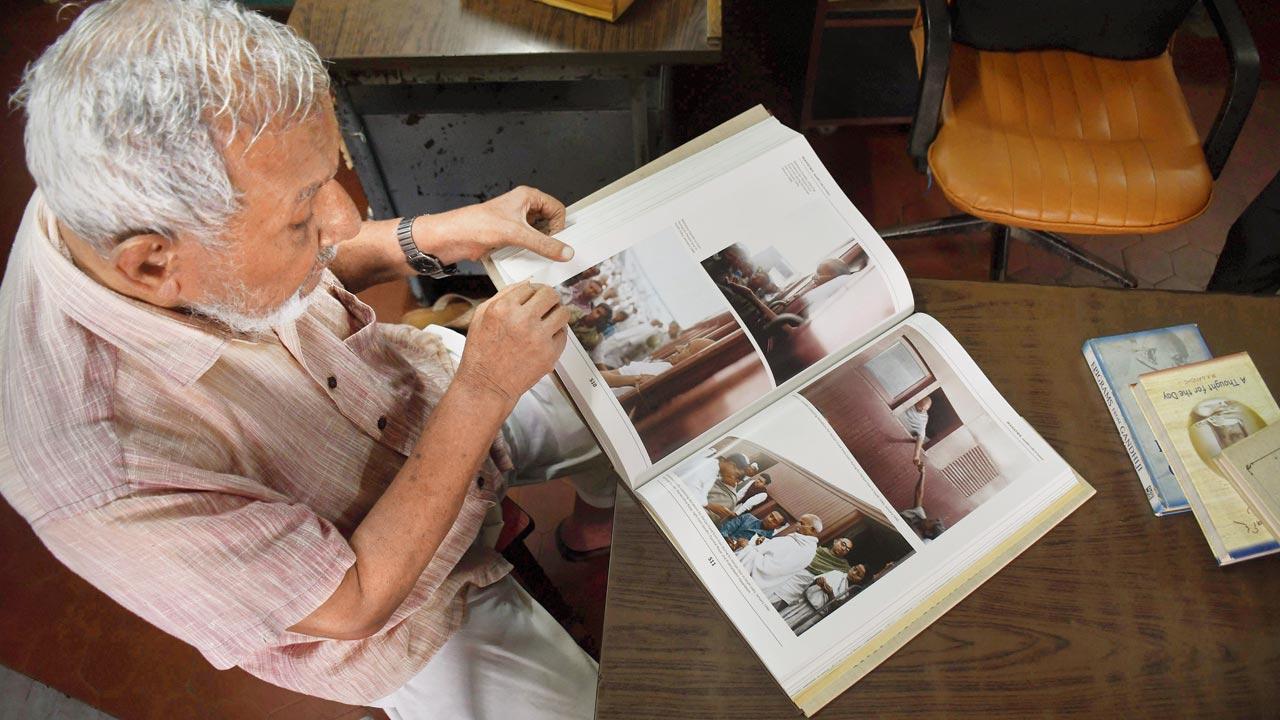 He peruses Gandhi’s Life in Colour, a photobook that documents each stage of the freedom fighter’s life in restored, colourful pictures. Pics/Ashish Raje
