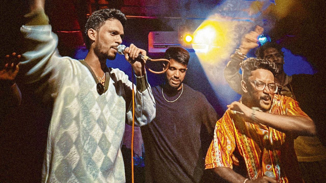 Sagvekar performs alongside fellow rappers at a gig