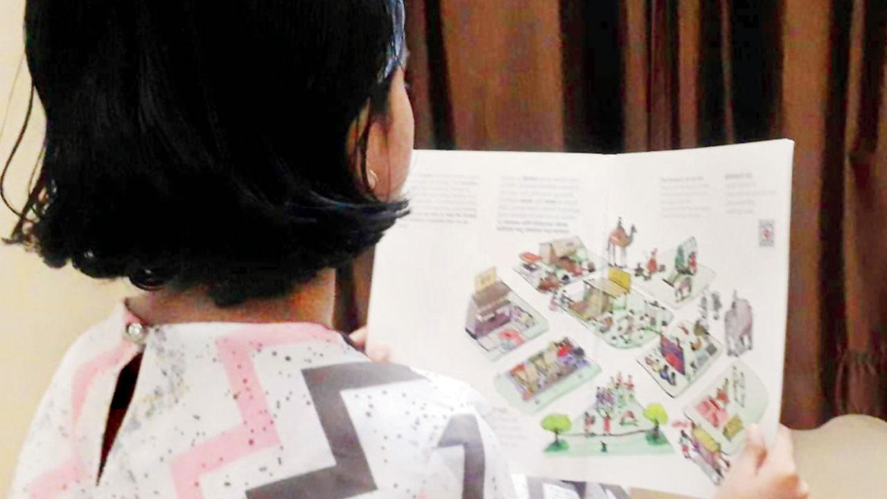 Sanavi looks at an illustration about Pune’s famous peths. Pics courtesy/Neelam Kinjawadekar