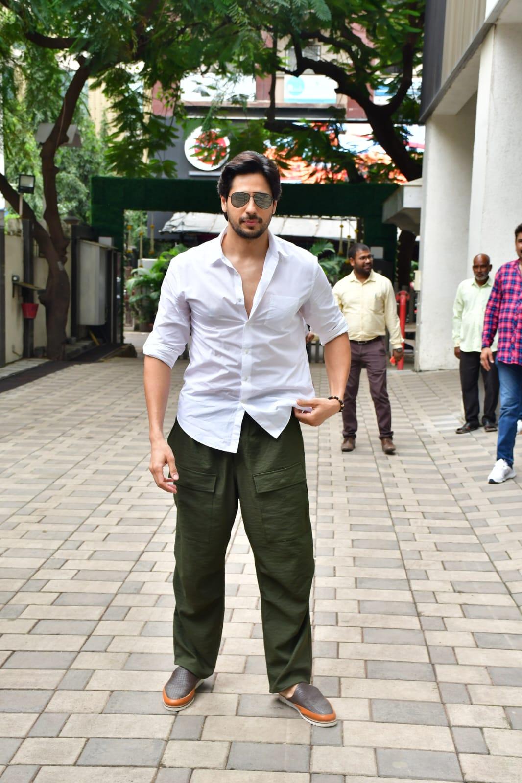 Sidharth Malhotra was seen at the T-Series office wearing a white shirt and green joggers