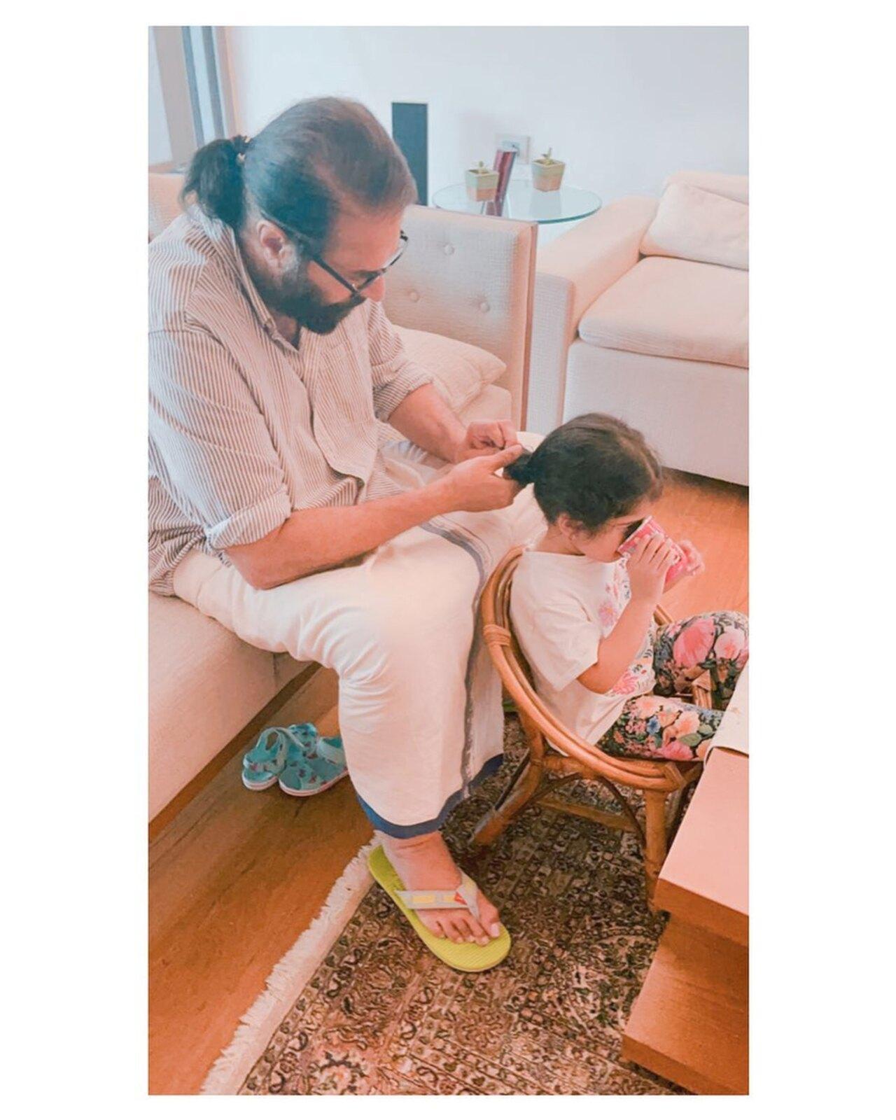 Mammootty adorably ties his granddaughter's hair as she get occupied with her toy