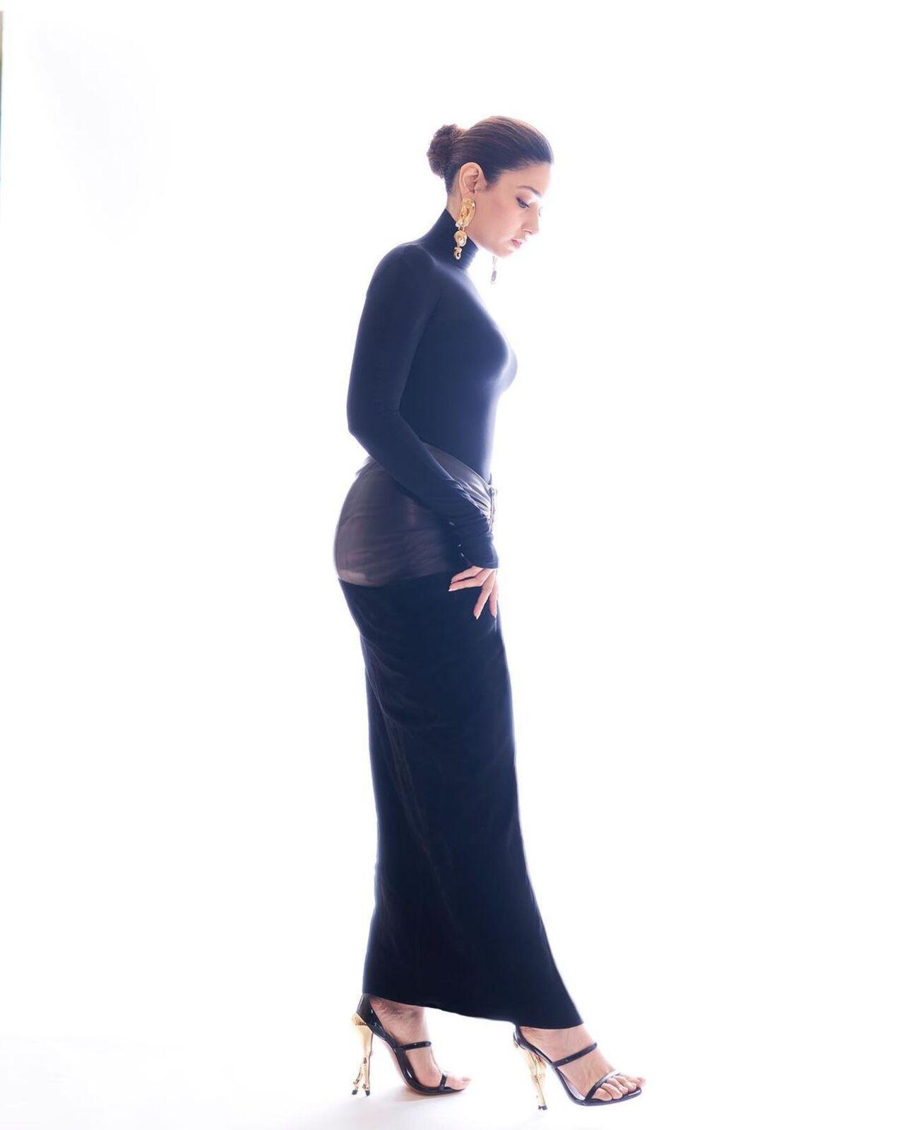 The head-to-toe bodycon outfit perfectly accentuated her curves. The actress tied her hair in a tight bun and opted for statement gold earrings to complete the look