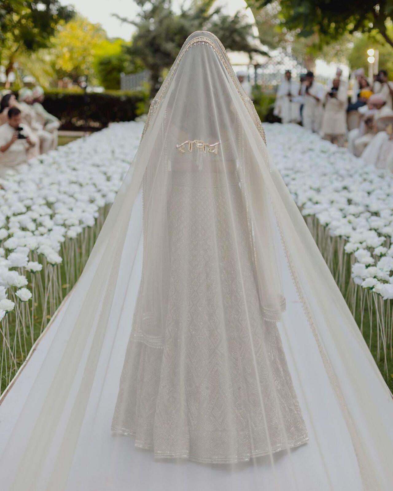 Parineeti Chopra walked down the aisle with a long white veil flowing from her head. The veil had the name of Raghav written on it in golden colour