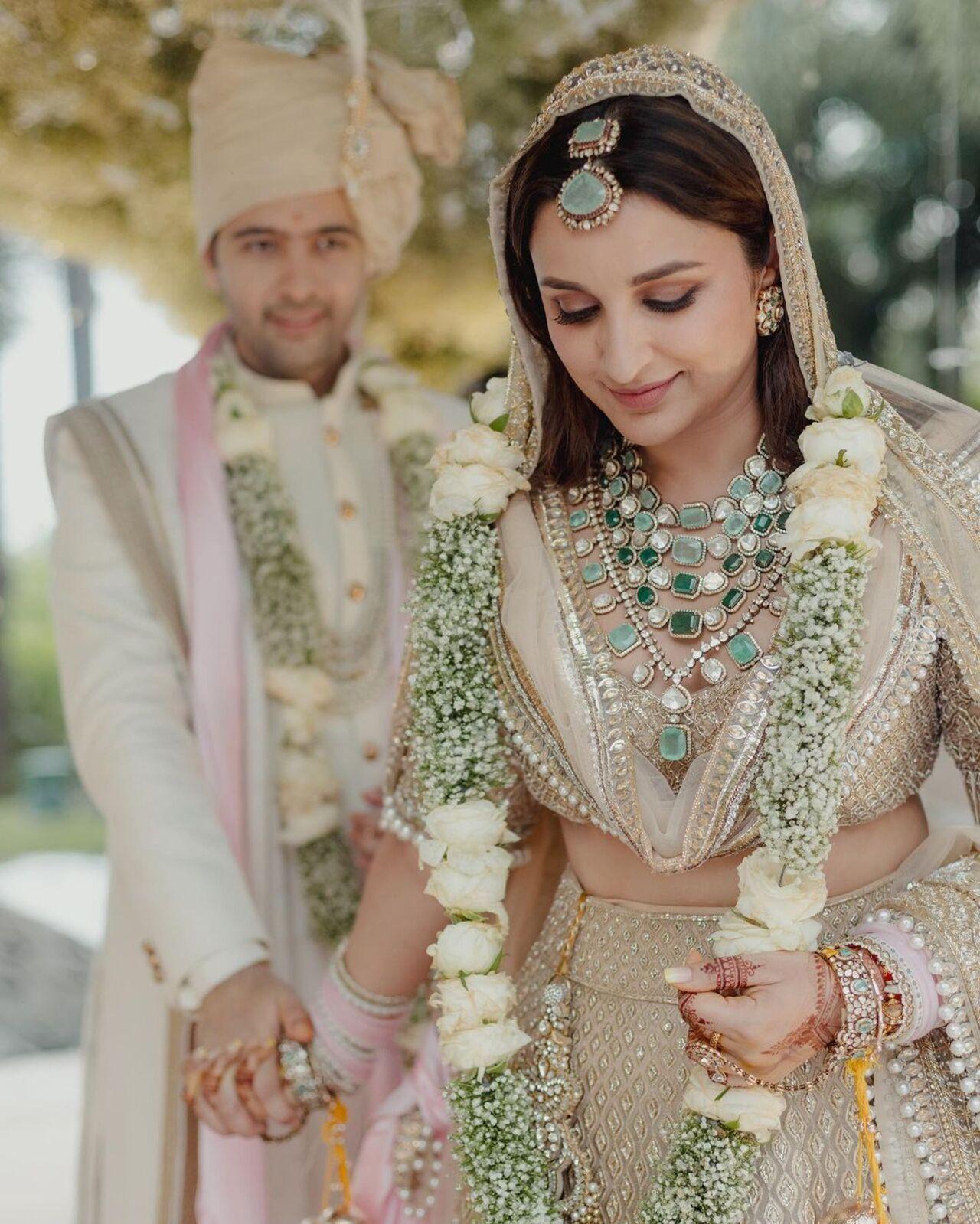 Along with her outfit, Parineeti wore statement emerald pearls around her neck, created by Manish Malhotra. 