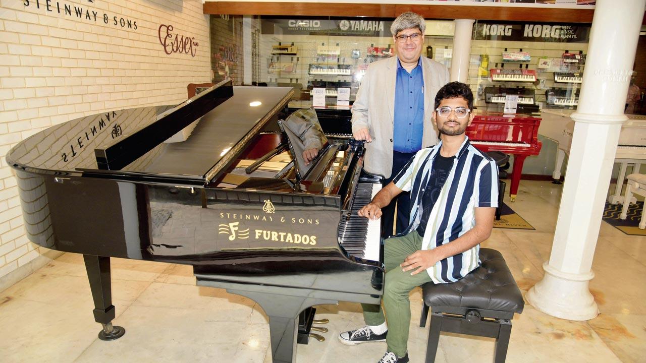 Con Brio festival director Smit Shah (on piano) and producer Anthony Gomes at the LM Furtado music store in Dhobi Talao