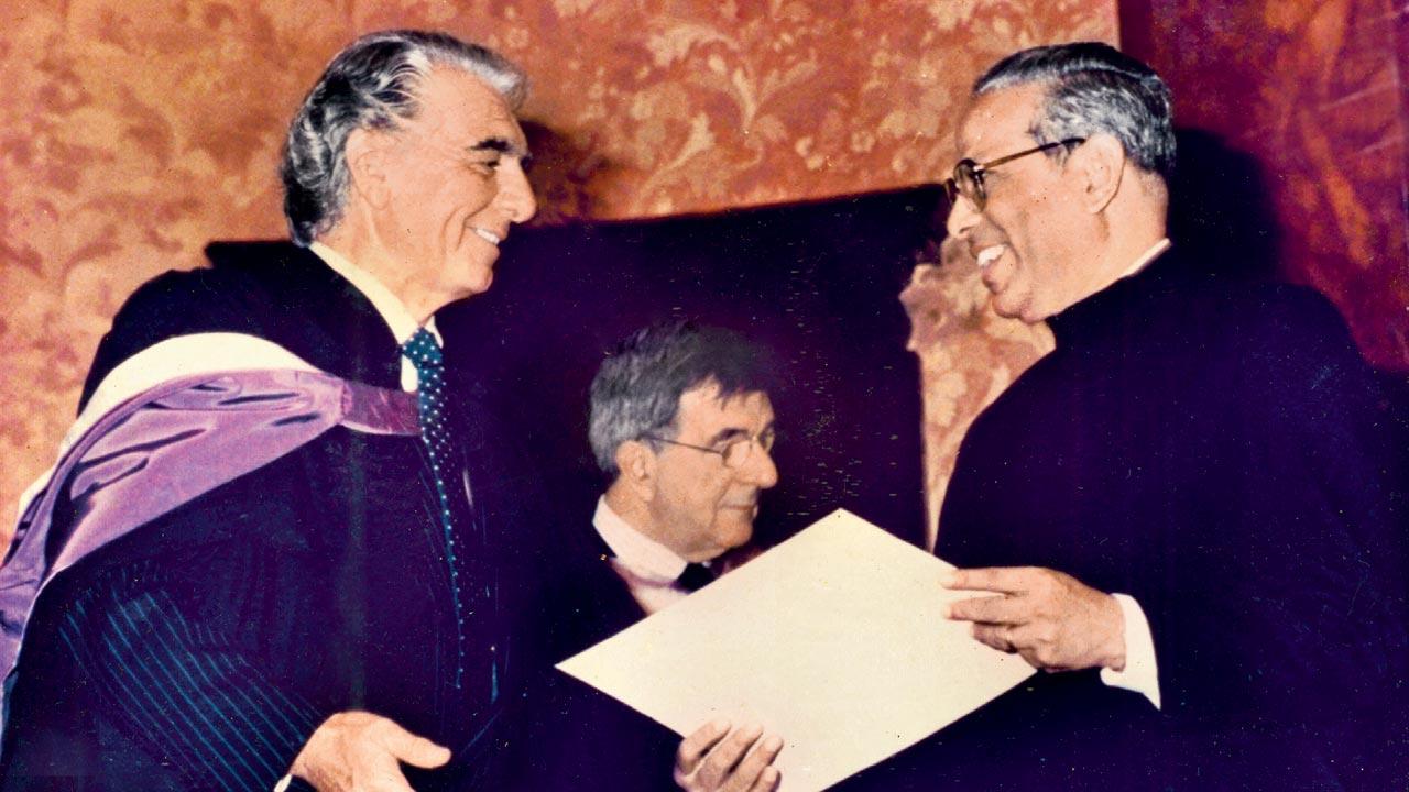 John Gomes (right) being conferred with Honorary Membership of Trinity College of Music at the hands of baritone Geraint Evans at Wigmore Hall, London, in 1987. Pic Courtesy/Furtados