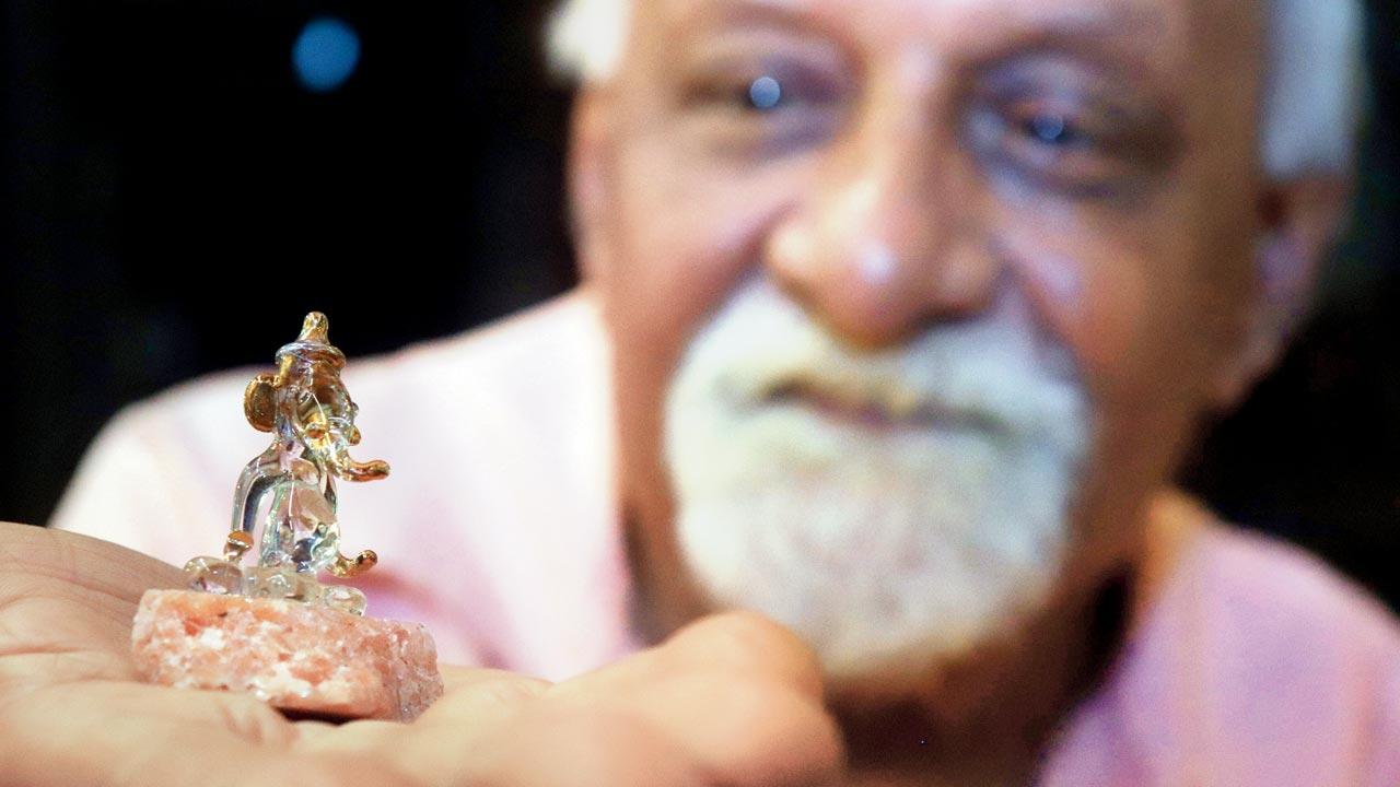 Rajkumar Goel dabbles in many arts: woodwork, handicrafts, and metal work and poetry, to name a few. He is also a specialist in making Ganesha idols, like this glass murthi.