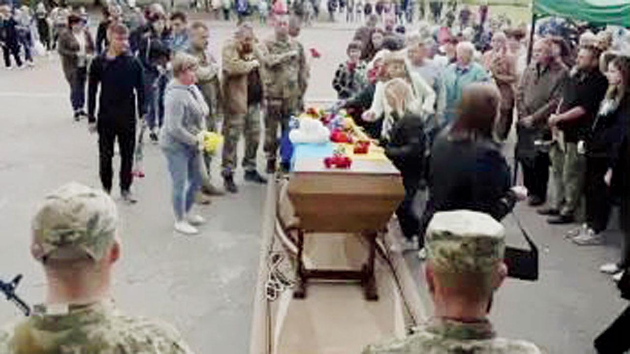 Hundreds including Ukrainian soldiers, family and mourners gathered in Shostka, Ukraine, for the funeral of Andrii Grinchenko who fought in the key battle for Andriivka