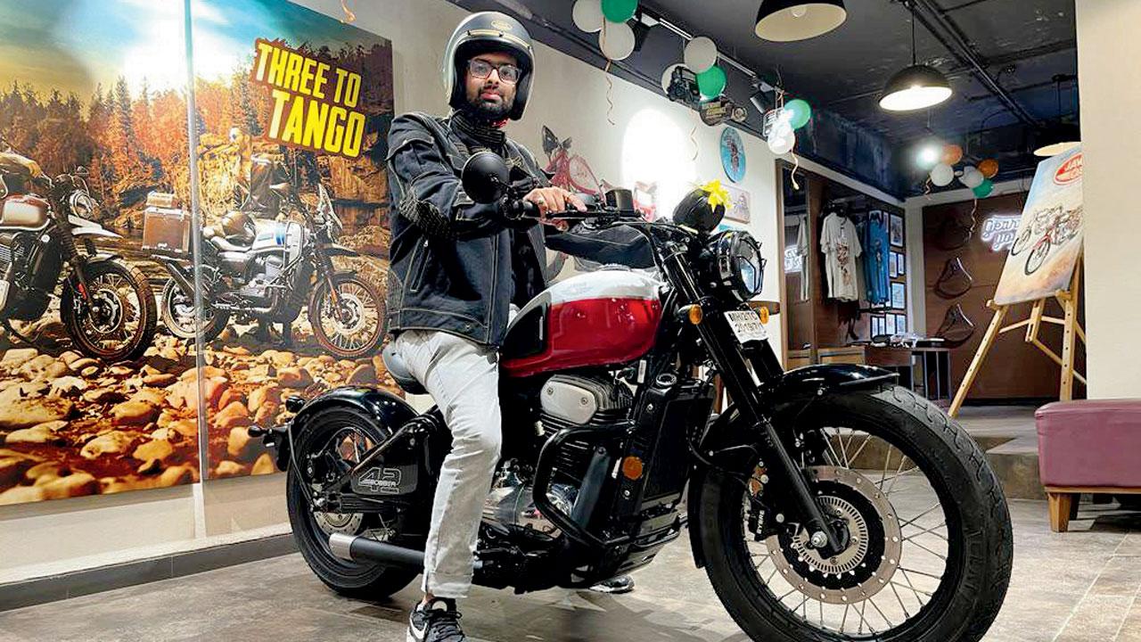 Yash Bhawani seen with his bike, complementary jacket and helmet