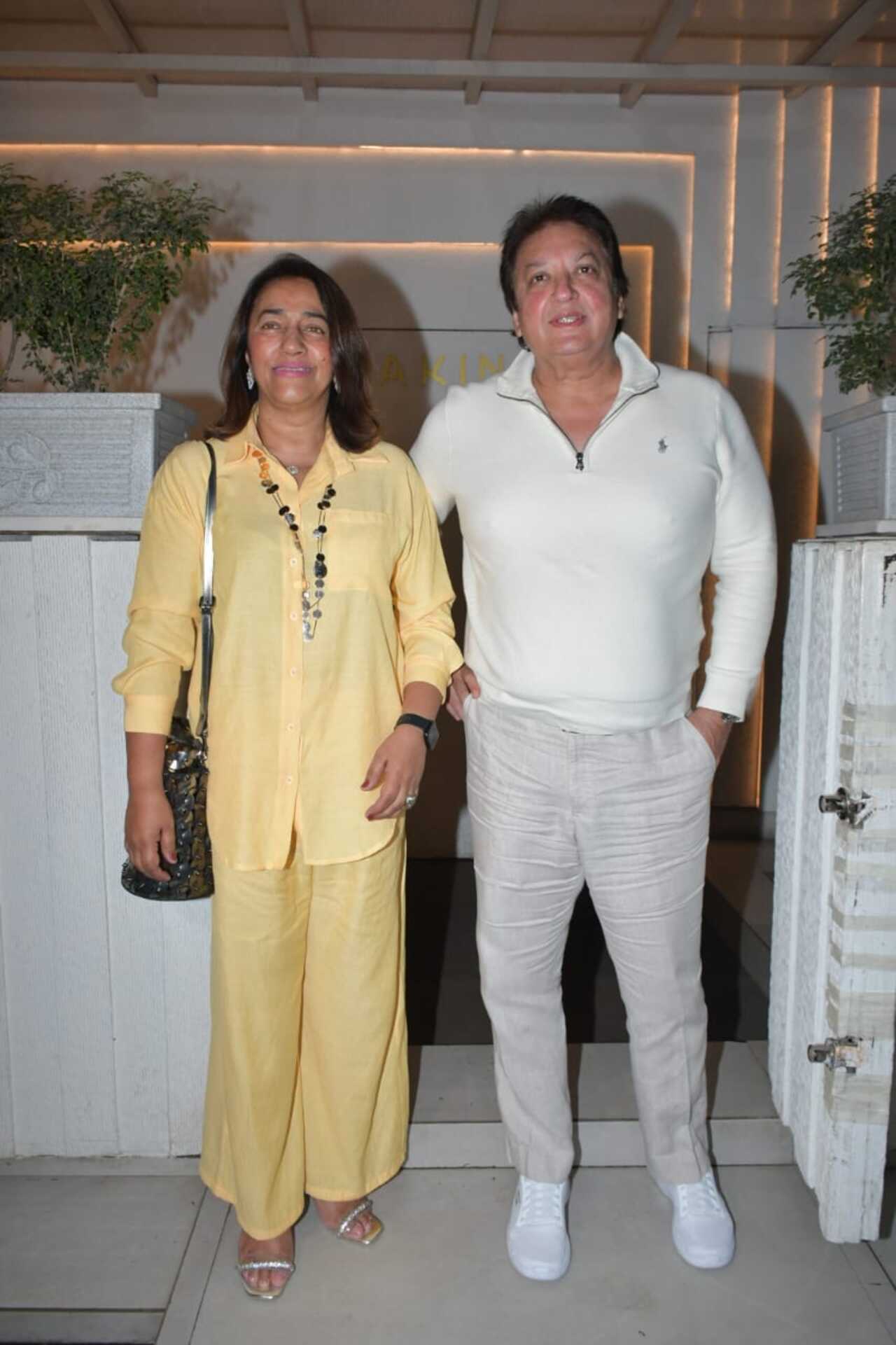 Akansha's parents Anu and Shashi Ranjan posed for the paparazzi outside the party venue. While she was dressed in an all-yellow outfit, he opted for a white attire