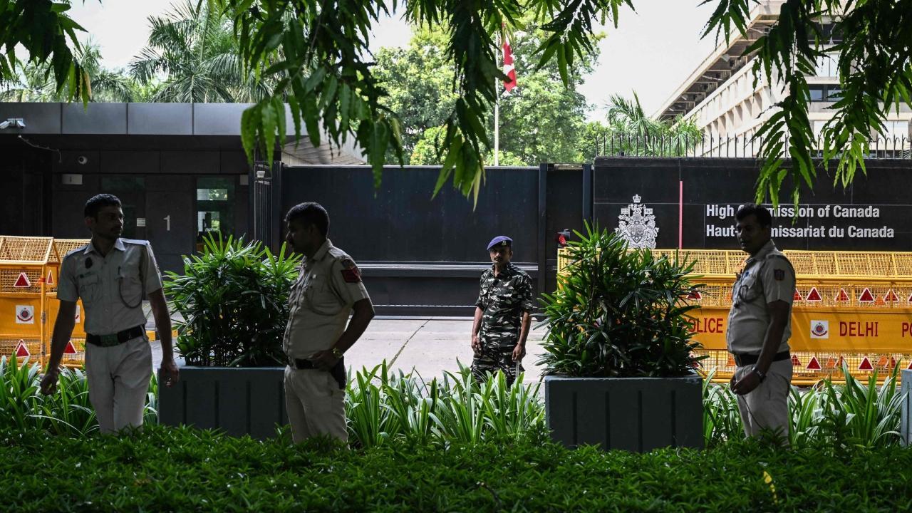 Security personnel stand guard in front of the High Commission of Canada in New Delhi. Pics/AFP