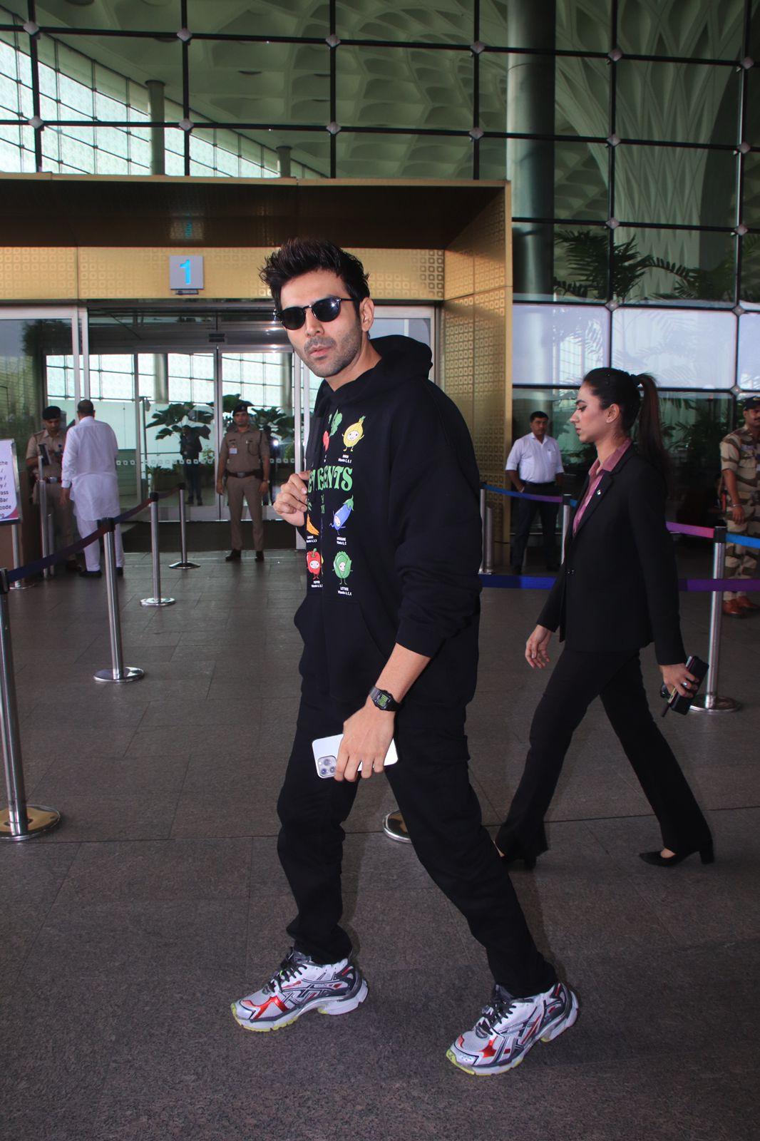 Kartik Aaryan looked cool in a black hoodie adorned with interesting and colourful designs as he was spotted at the airport