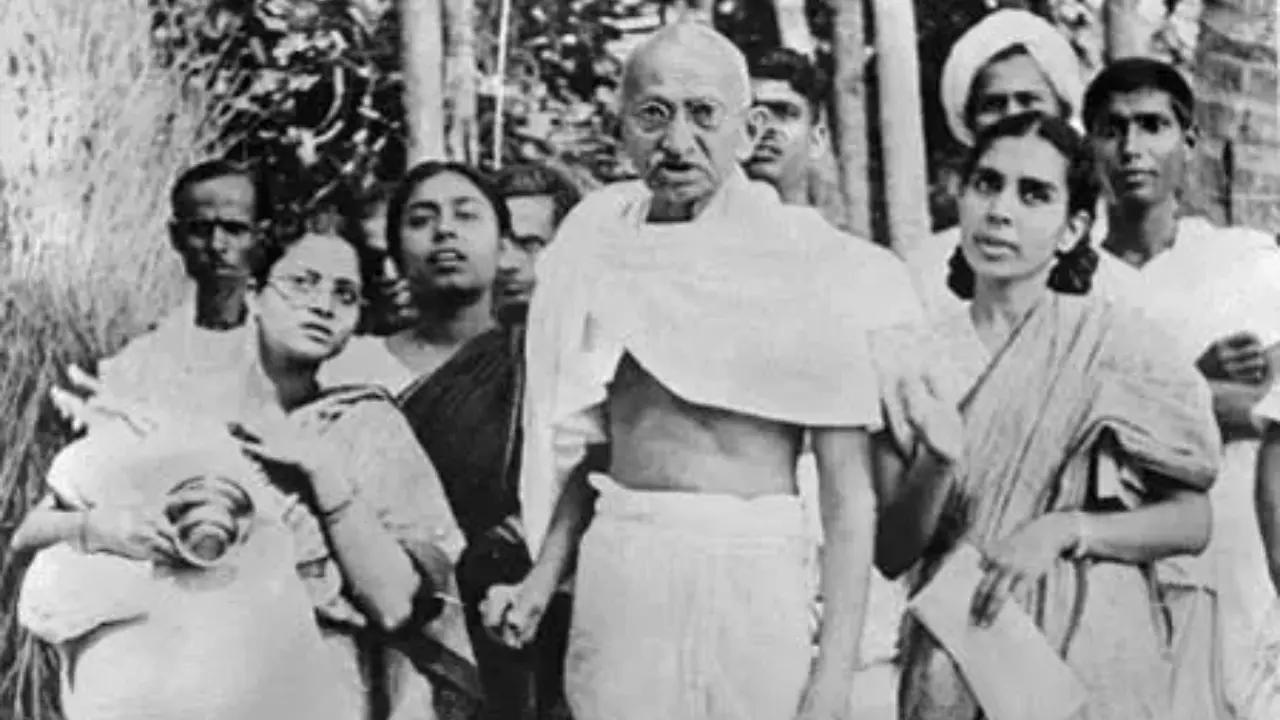Mahatma Gandhi (center) in the company of women during his 1946 tour of the Bengal province