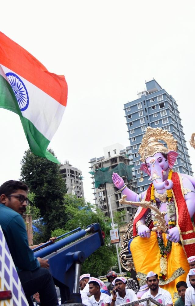 Devotees carry Lord Ganesha idol
