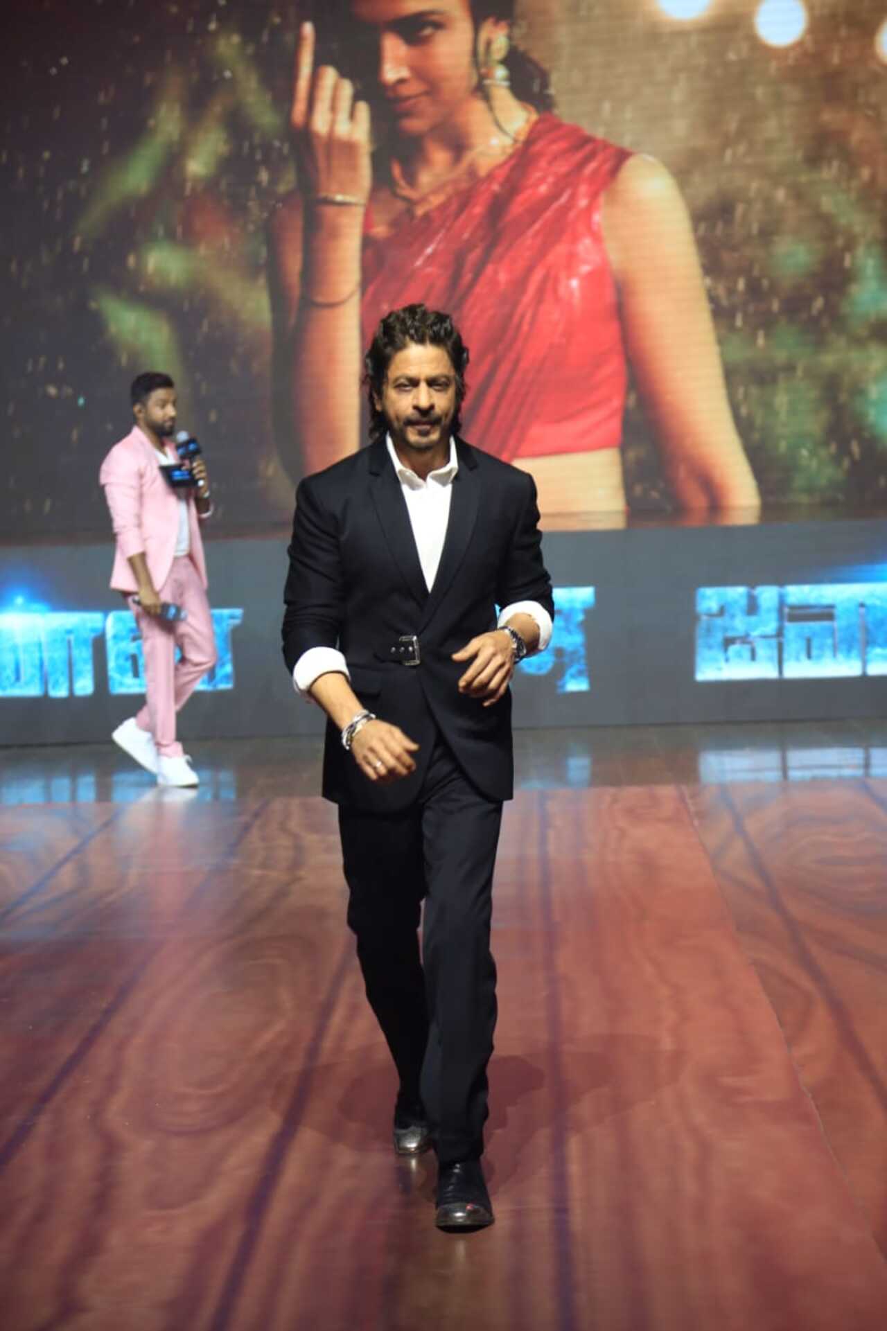 Shah Rukh Khan looked dapper for the success meet in a black suit and a hairdo that reminded fans of his Don days