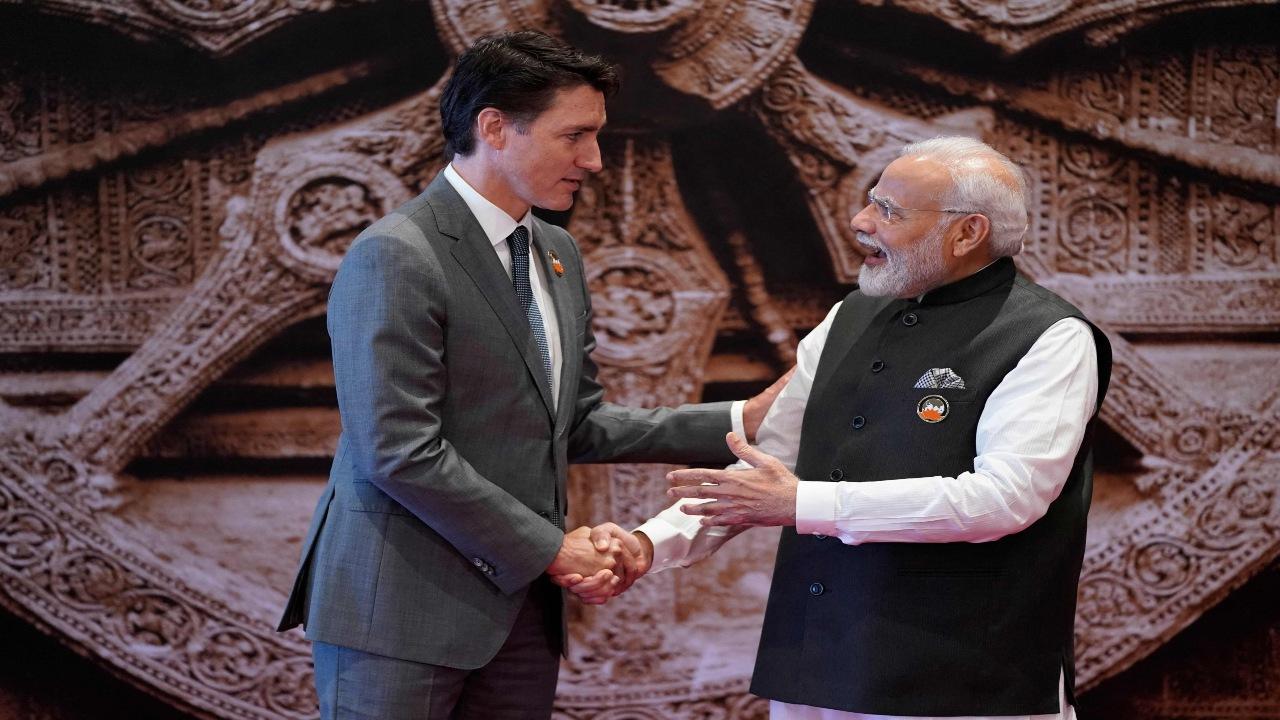 India's Prime Minister Narendra Modi (R) shakes hand with Canada's Prime Minister Justin Trudeau ahead of the G20 Leaders' Summit in New Delhi on September 9, 2023.