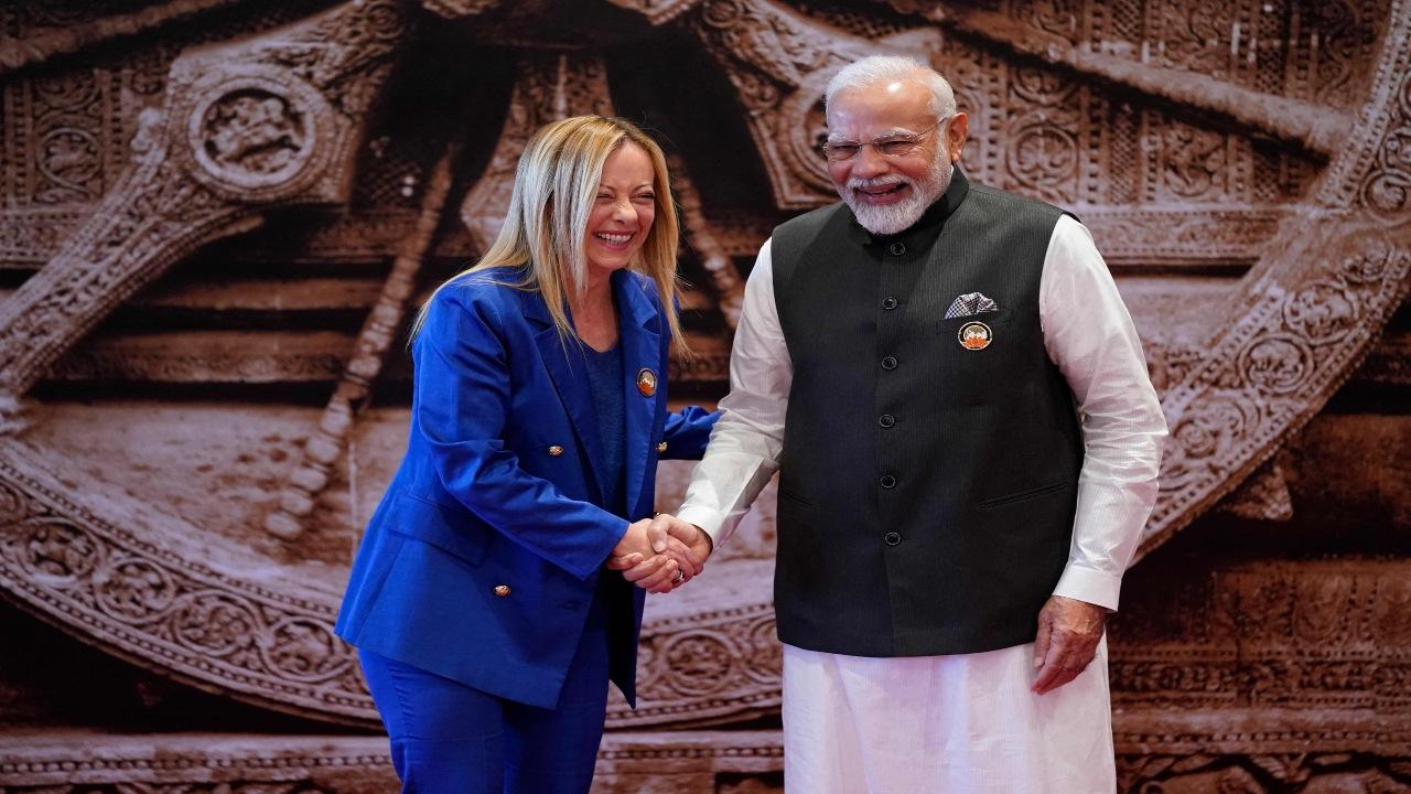 Indian Prime Minister Narendra Modi welcomes Italy Prime Minister Giorgia Meloni upon her arrival at Bharat Mandapam convention center for the G20 Summit, in New Delhi, India, Saturday, Sept. 9, 2023. 